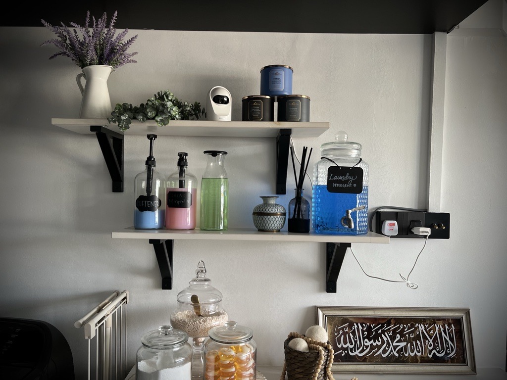 A digital journal of our home improvement projects - lavender, white vase, green plants, black shelves, black and white