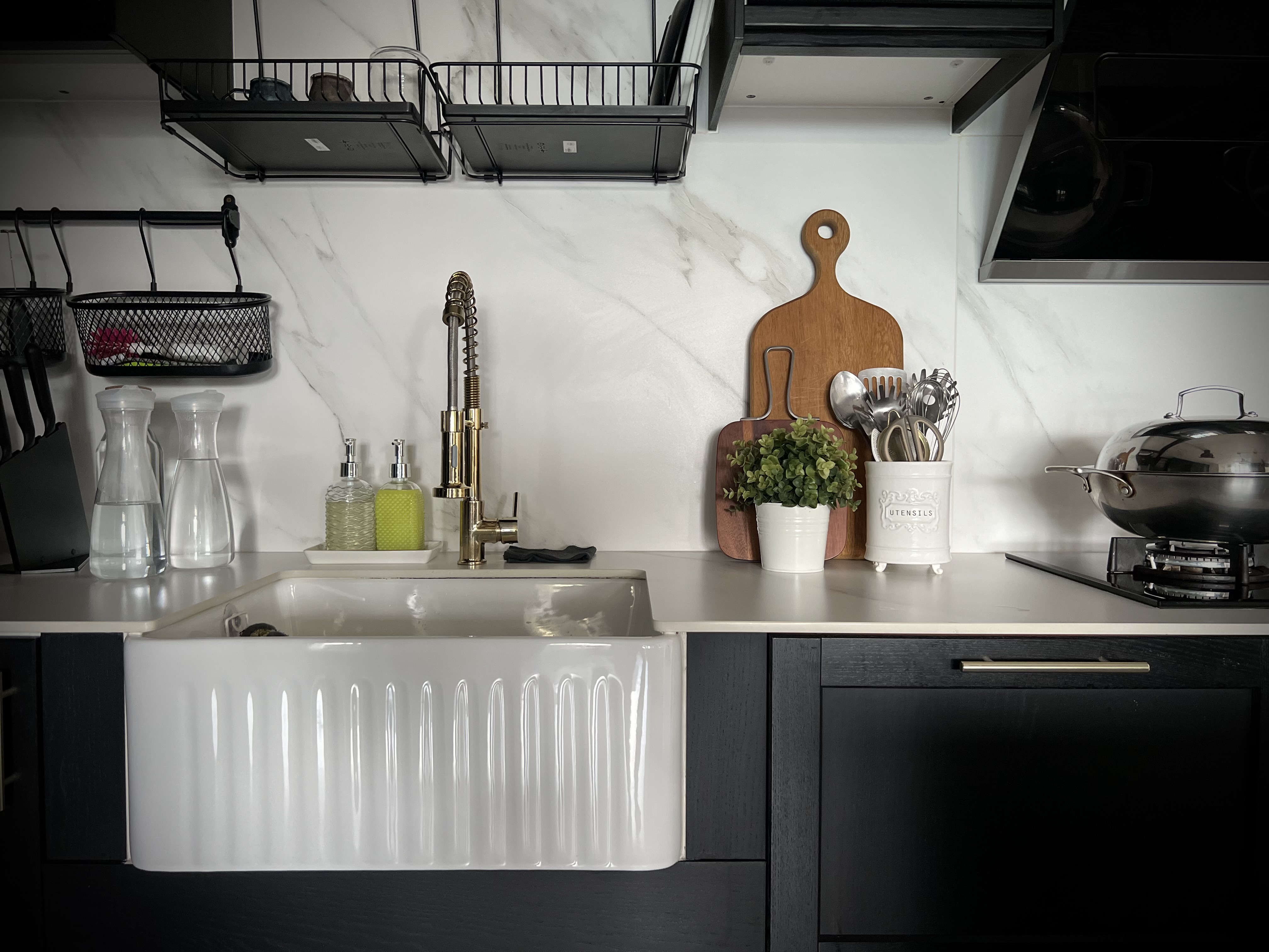 A digital journal of our home improvement projects - White kitchen sink, black countertop, modern faucet, wooden cutting