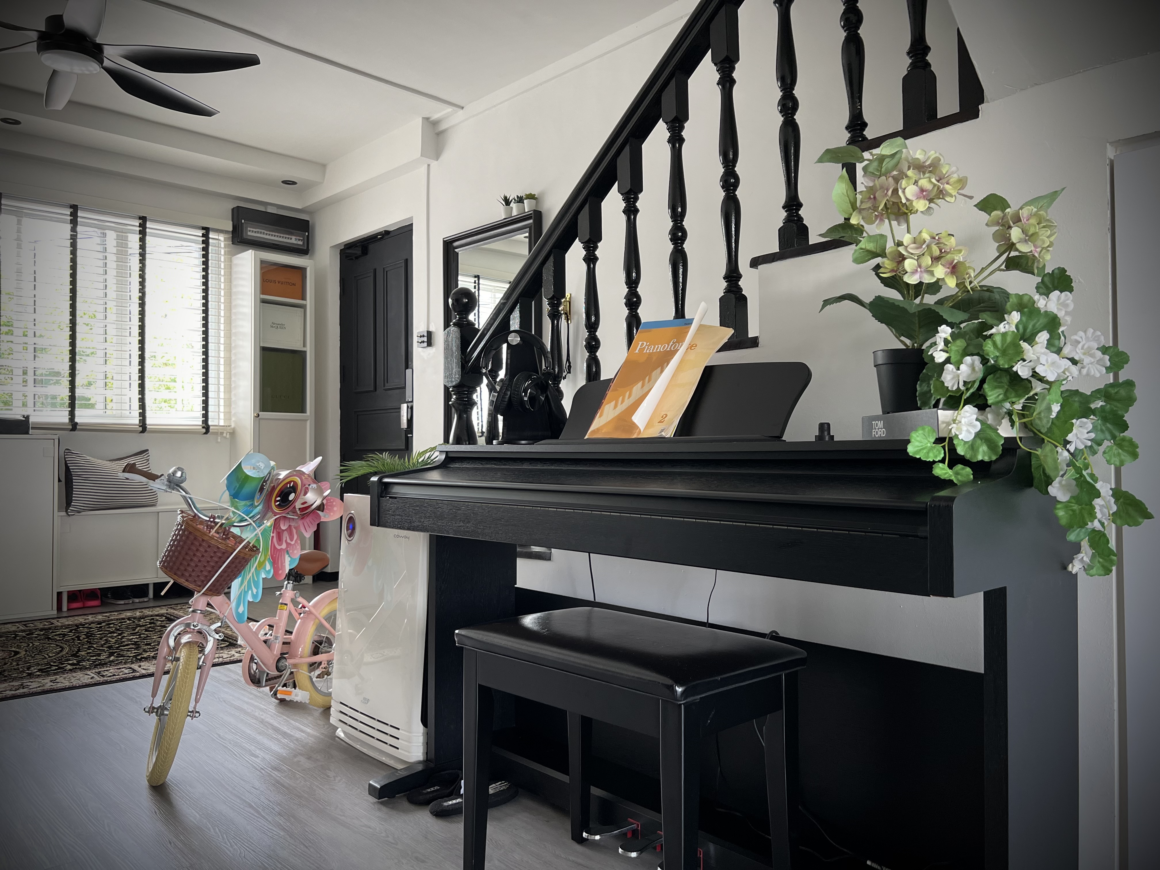 A digital journal of our home improvement projects - black piano, black staircase, white walls, black chair, white rug, black
