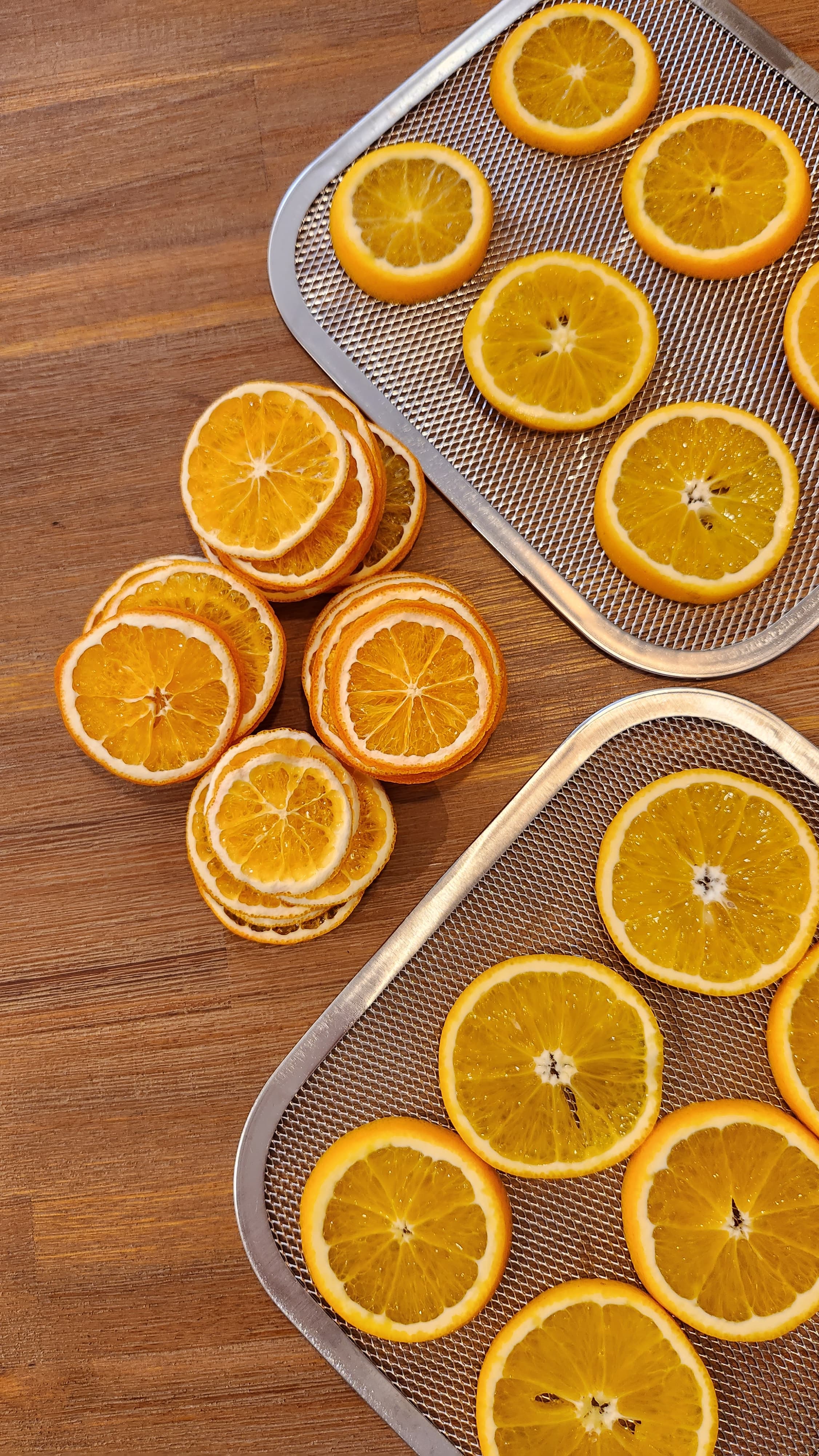 Orange you glad it's nearly Christmas? - sliced oranges on metal tray, fresh citrus fruit preparation, orange slices on