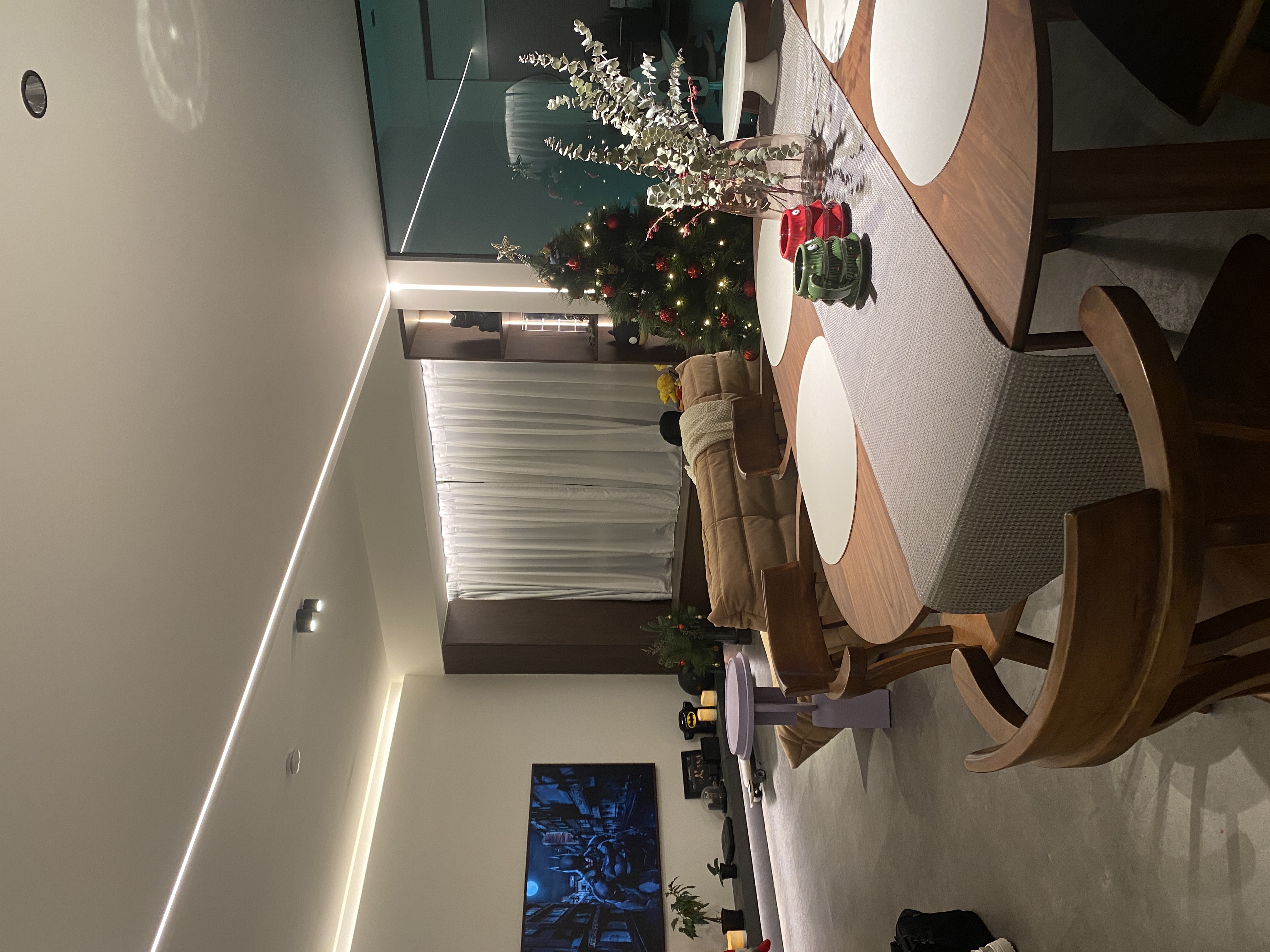 This the season to be jolly - Modern dining room, cozy living space, warm lighting, Christmas tree, festive decorations