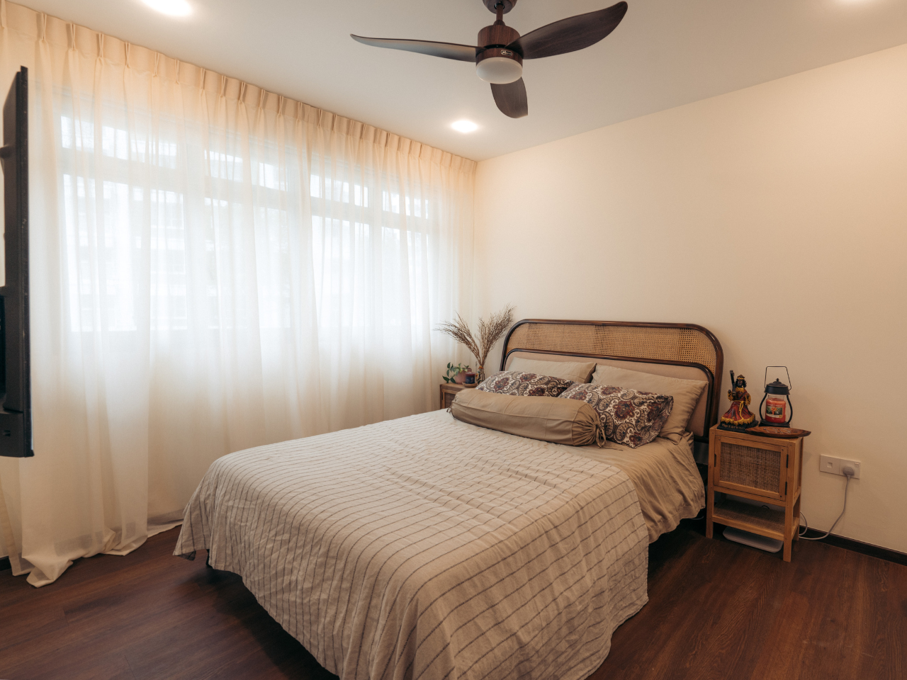 Transforming our HDB flat to a Filipino-inspired Villa Home - Sunlit bedroom, cozy room, large bed, beige bedding, patterned