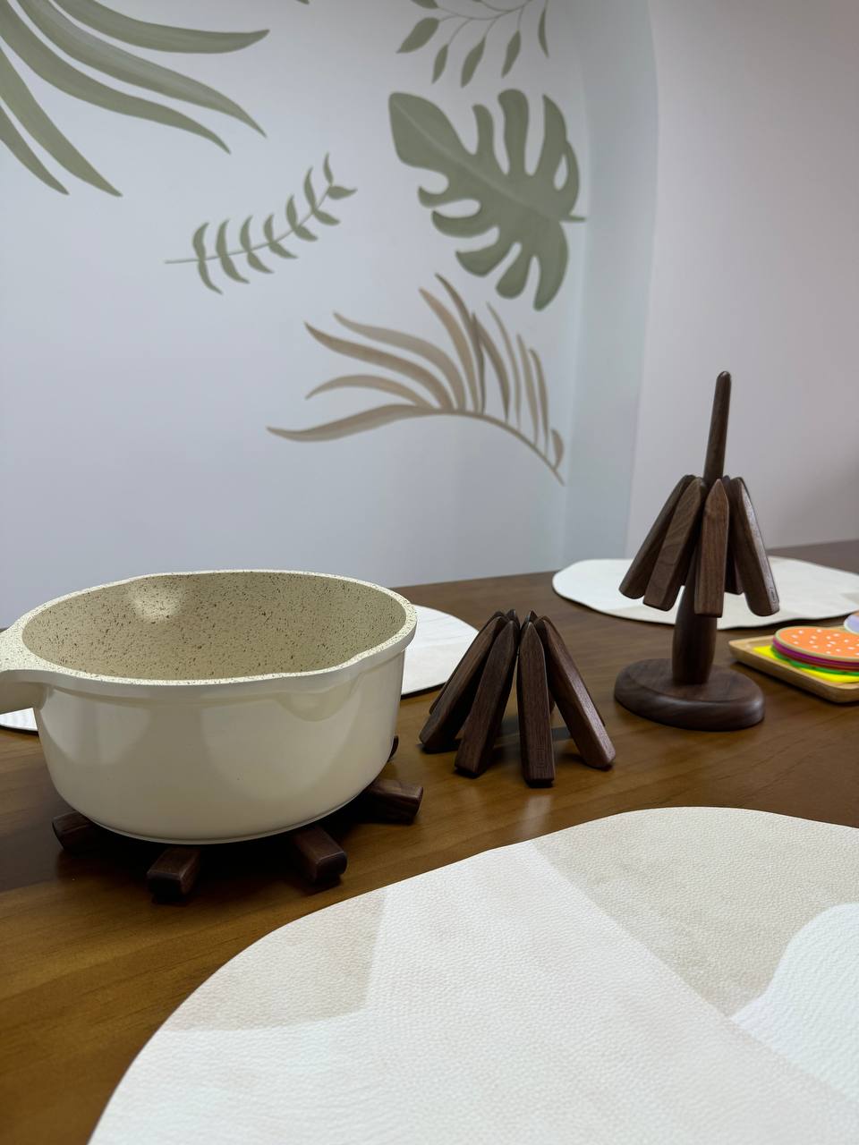 Mingle & Munch: Savouring Wholesome Vibes & Artful Bites - White ceramic pot with speckled texture, placed on wooden coaster