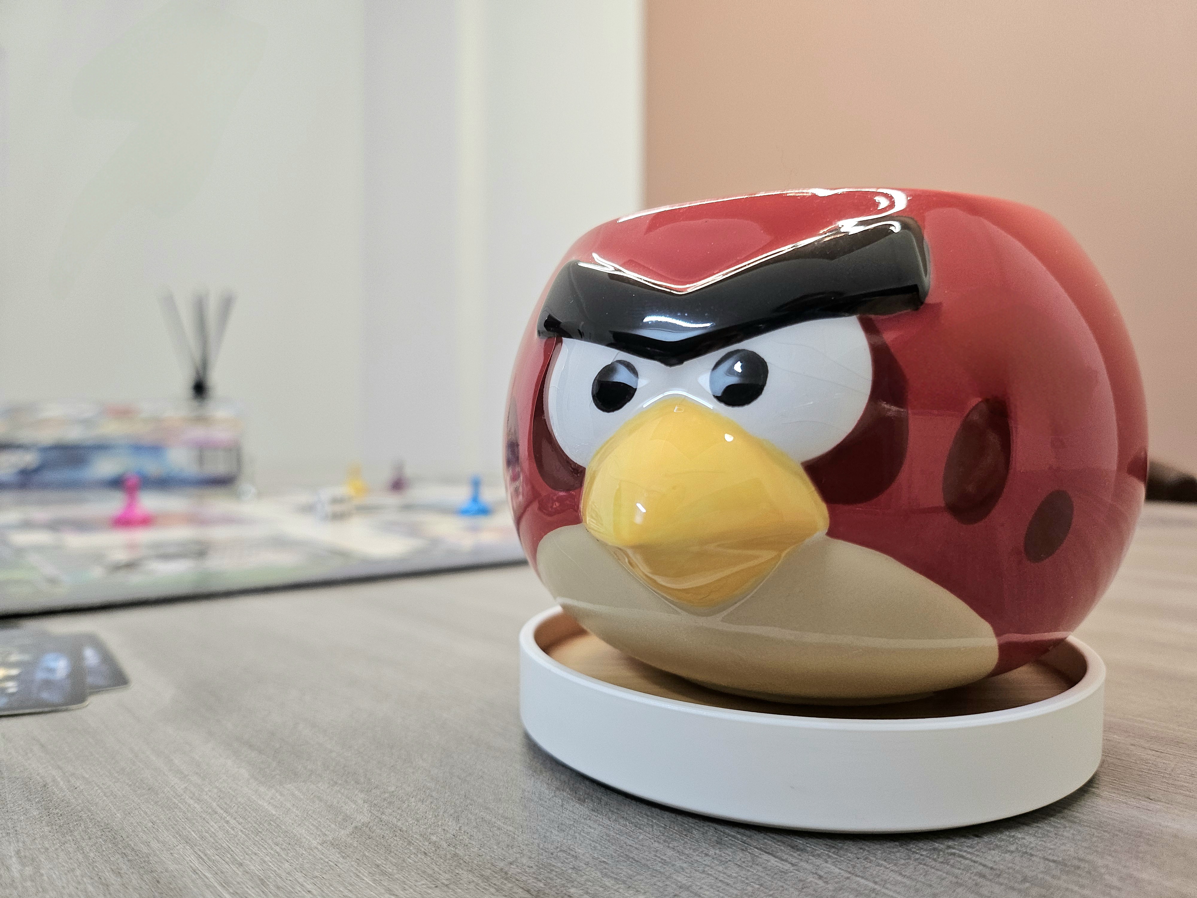 Our dining space: For Intimate Gatherings & Cherished Moments - Red Angry Birds figurine, glossy finish, detailed eyes, black