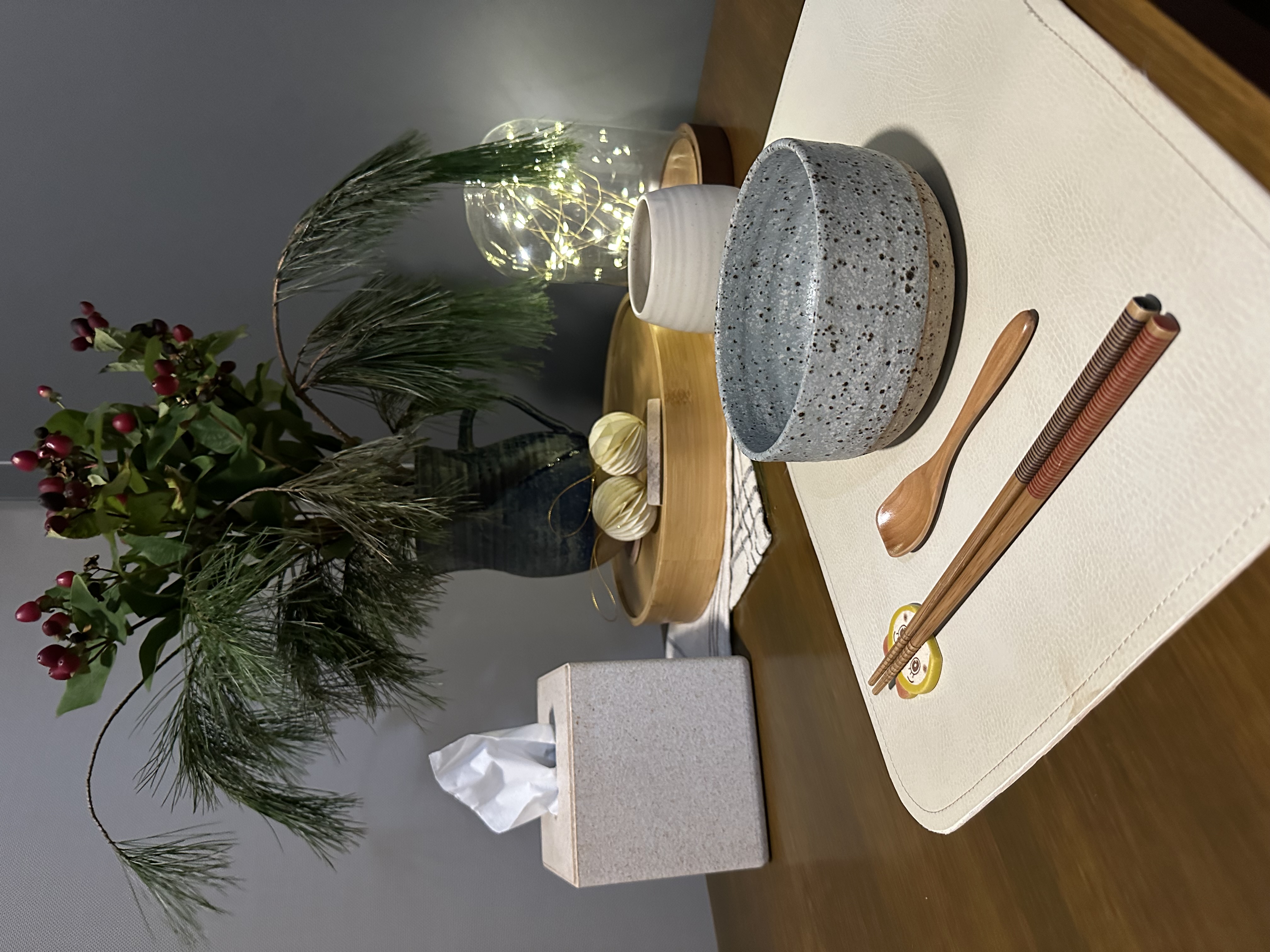 Dining on the balcony: what you need to know  - vibrant Christmas tree, cozy setting, rustic wooden table, decorative