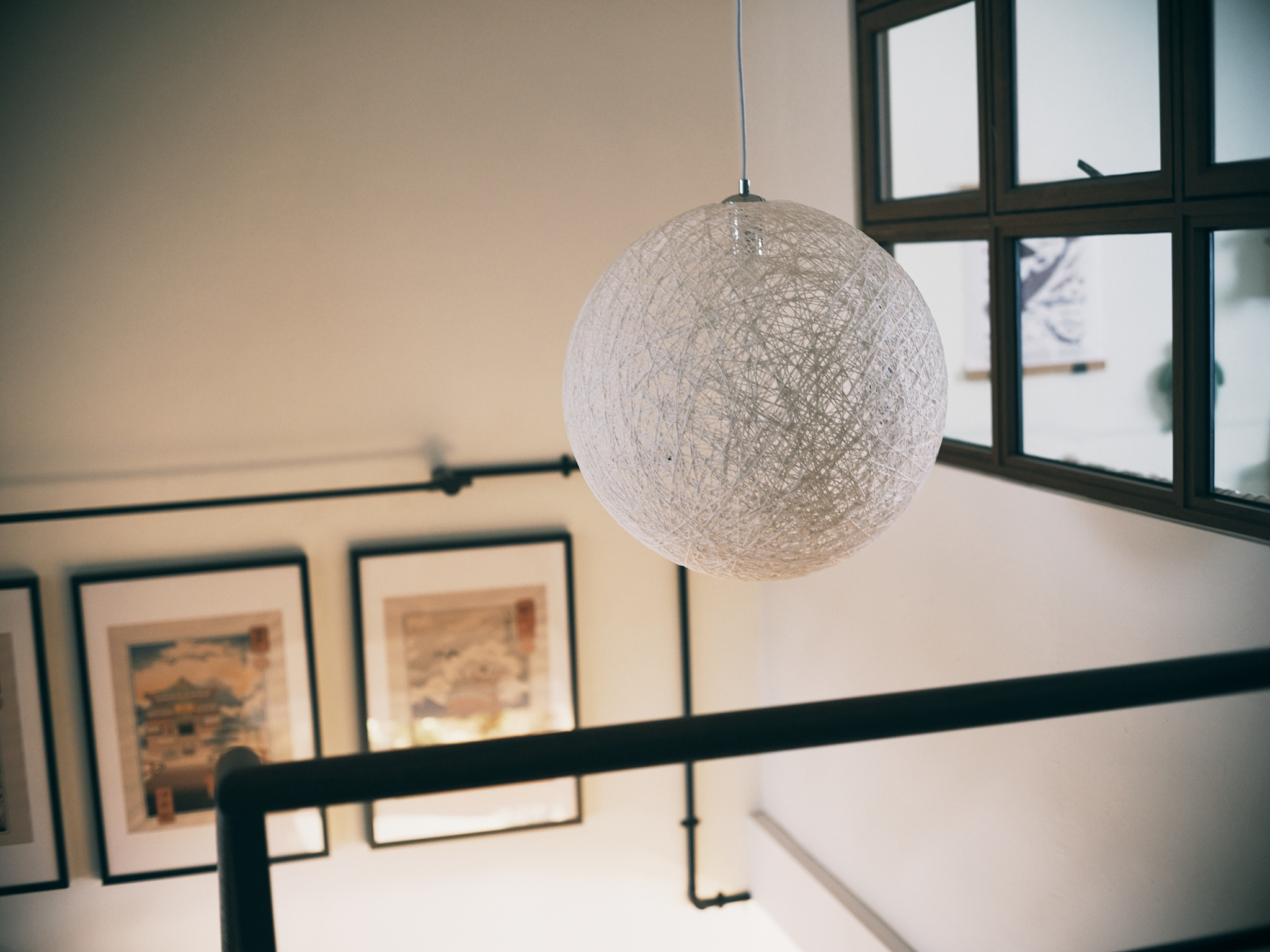 A family home with a vintage charm - modern interior, hanging light fixture, spherical design, textured material, natural