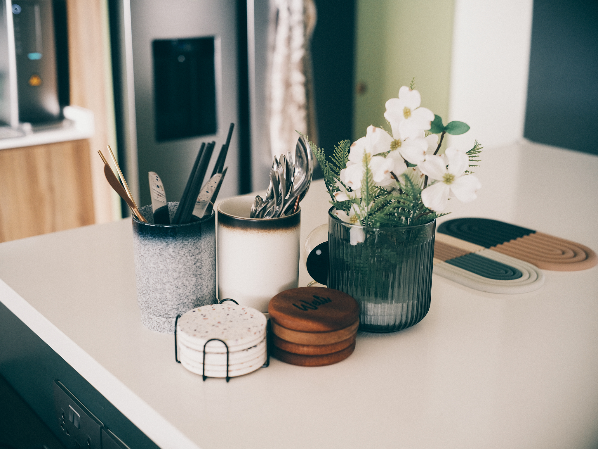 A mid-century family dining area - glass, kitchen, utensils, stainless steel, kitchenware, modern kitchen, countertop, white