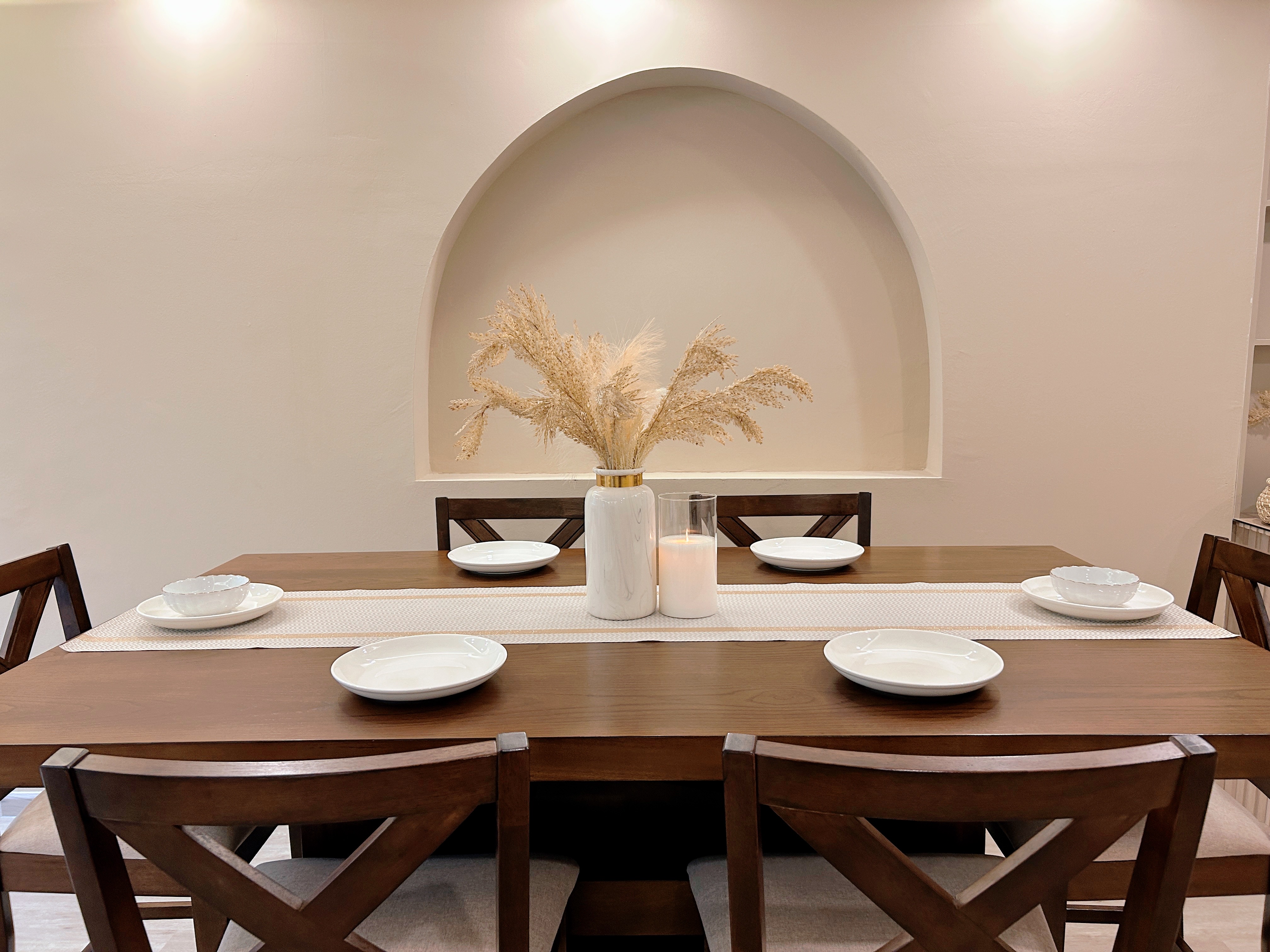 Our inviting dining space! - Modern dining room, minimalist decor, elegant table setting, wooden dining table, white plates
