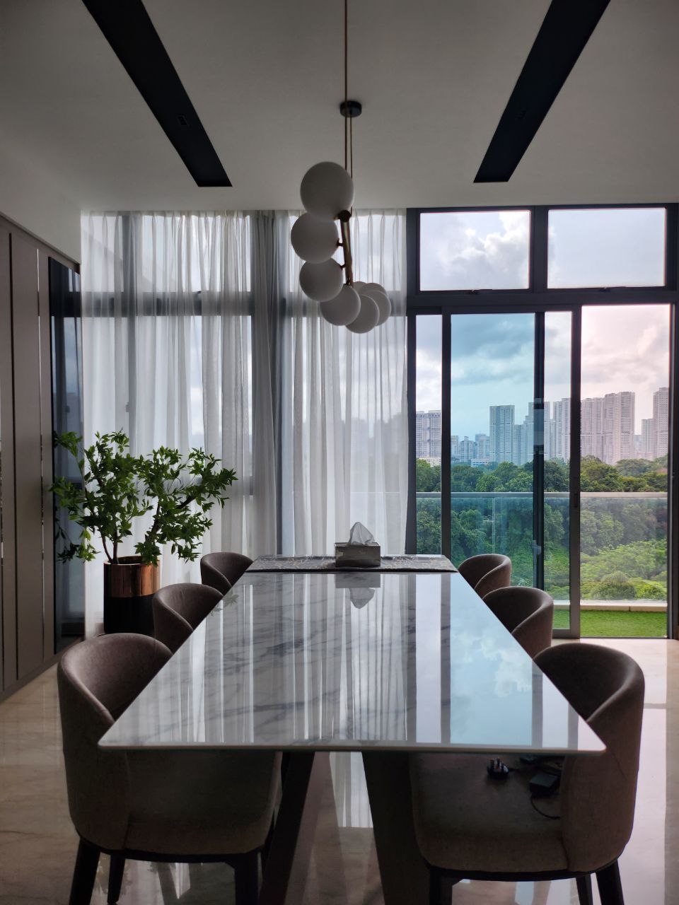 Our dining area(s): Not just one but two! - Modern dining room with sleek, minimalist design, large glass windows offering a