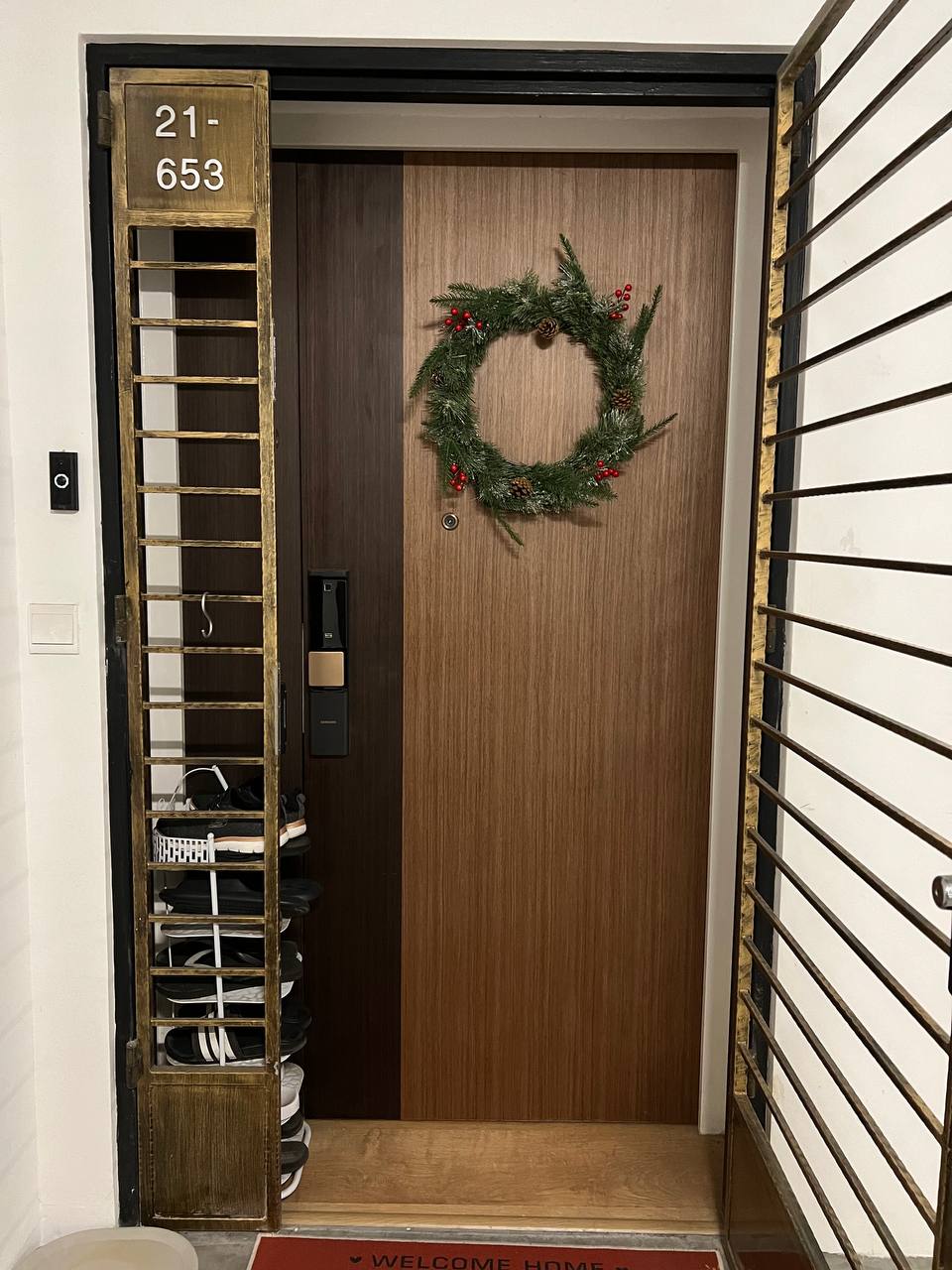 Entryway, step into our cozy haven of style and warmth 🏡✨ - Wooden door, festive wreath, number 21-653, black door handle