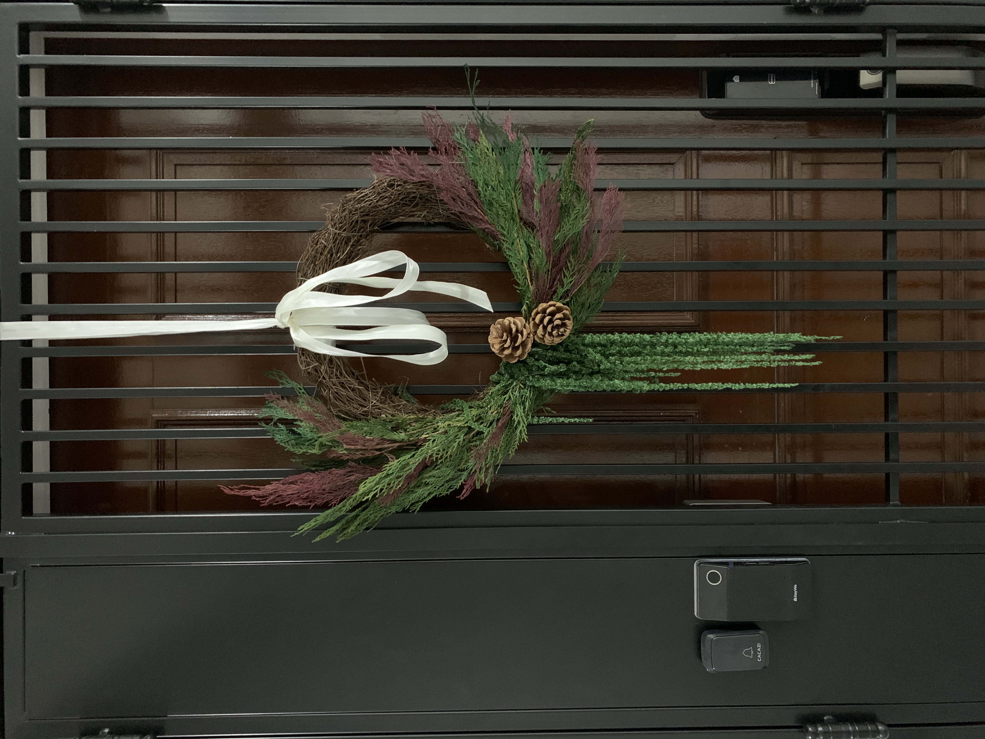 A maximalist Christmas set-up with DIY touches! - Winter wreath, festive decoration, green foliage, purple flowers, pine