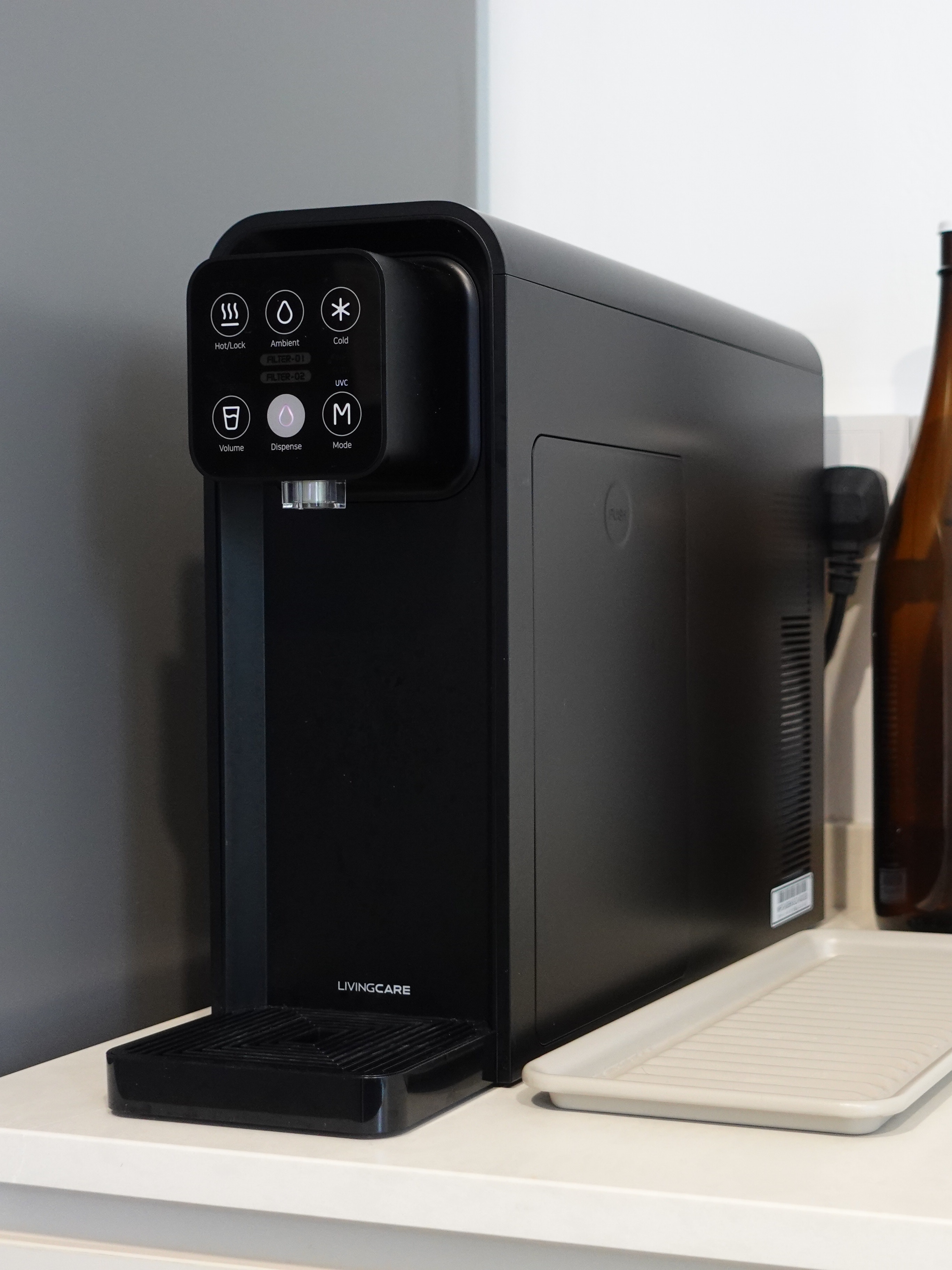 How we kept our dining room visually clutter-free - smart home device, coffee machine, black model, living room, kitchen