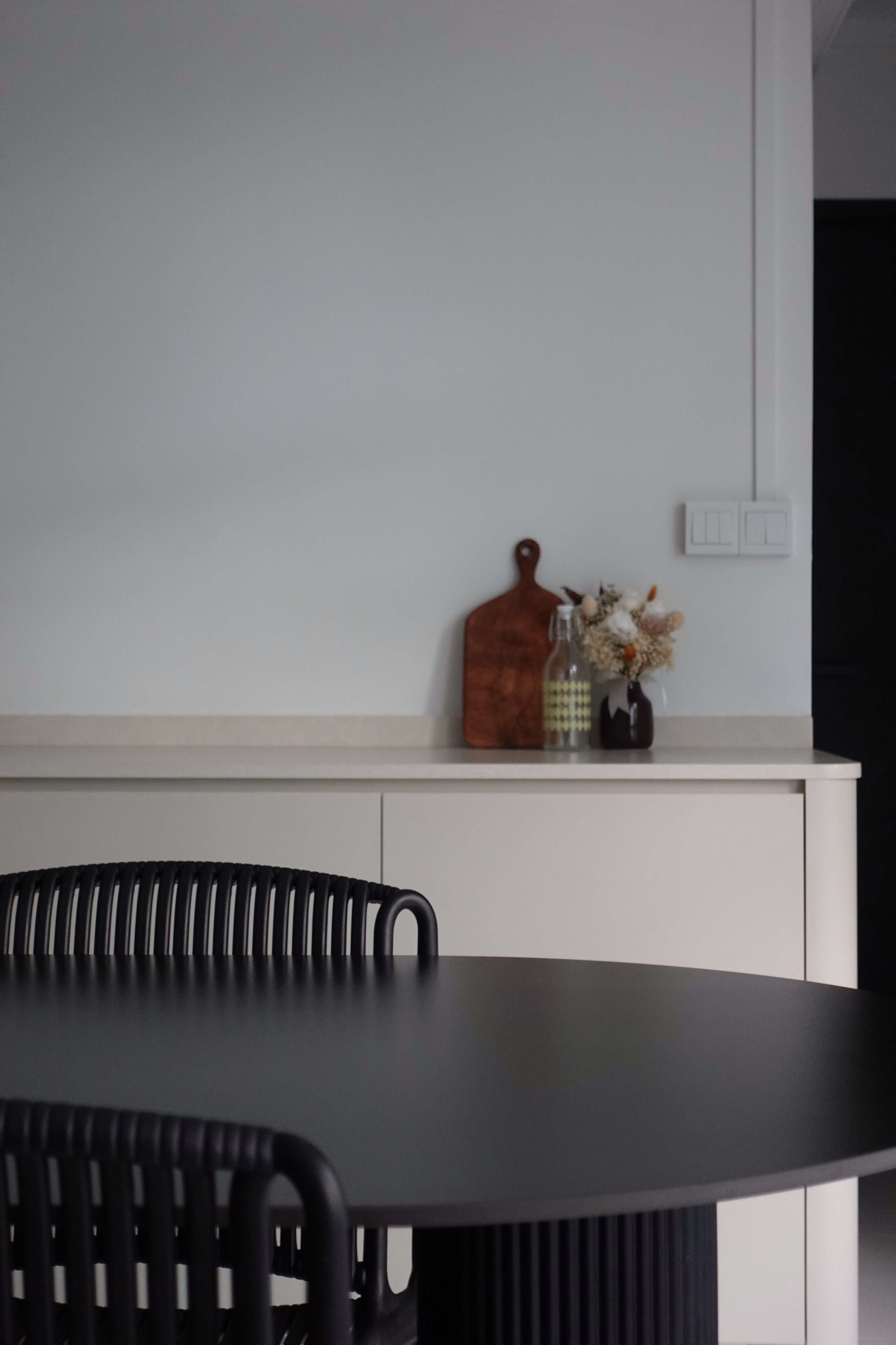 How we kept our dining room visually clutter-free - modern kitchen countertop, minimalist design, black dining table, sleek