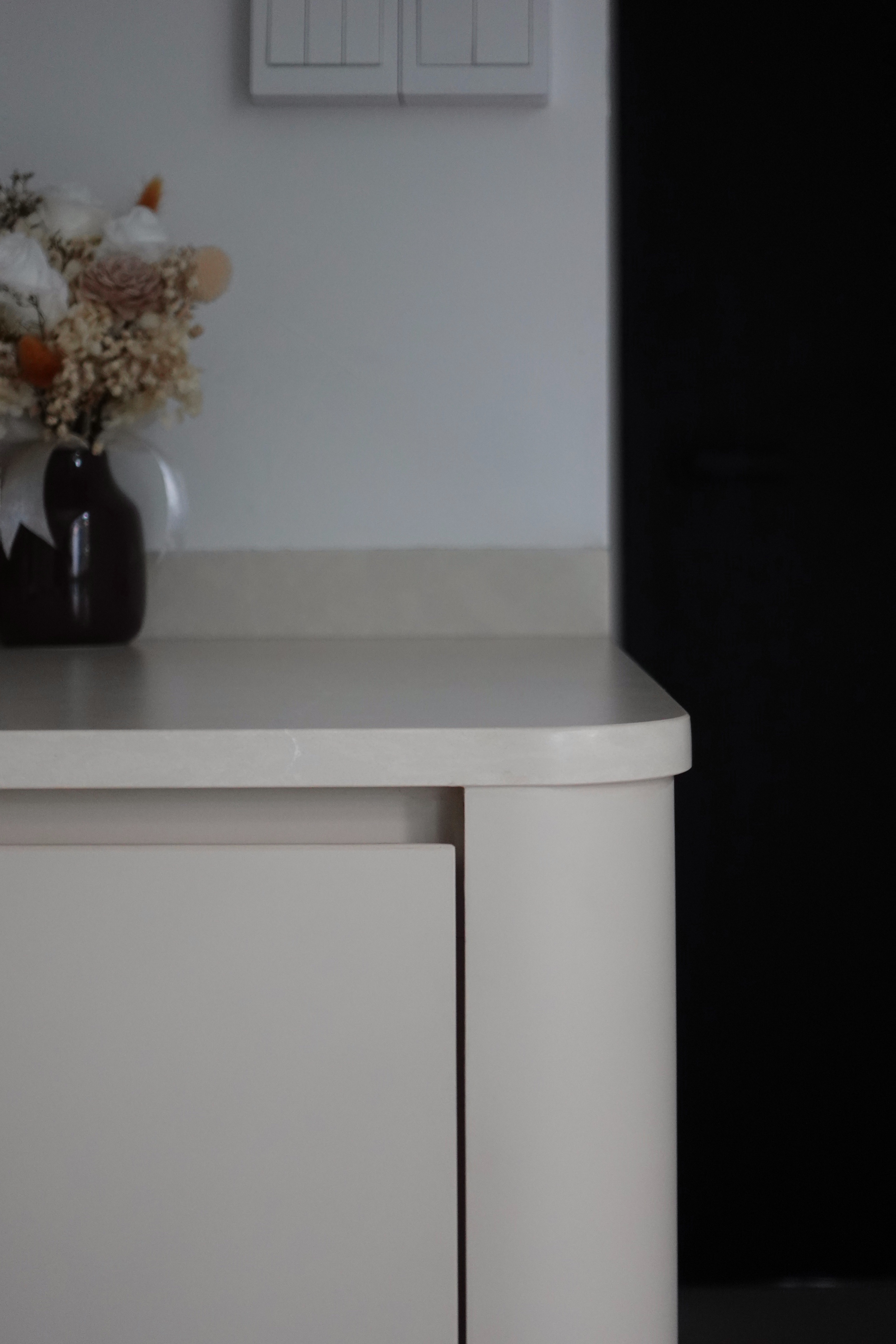 How we kept our dining room visually clutter-free - vase, flowers, minimalist, modern, white countertop, light gray wall