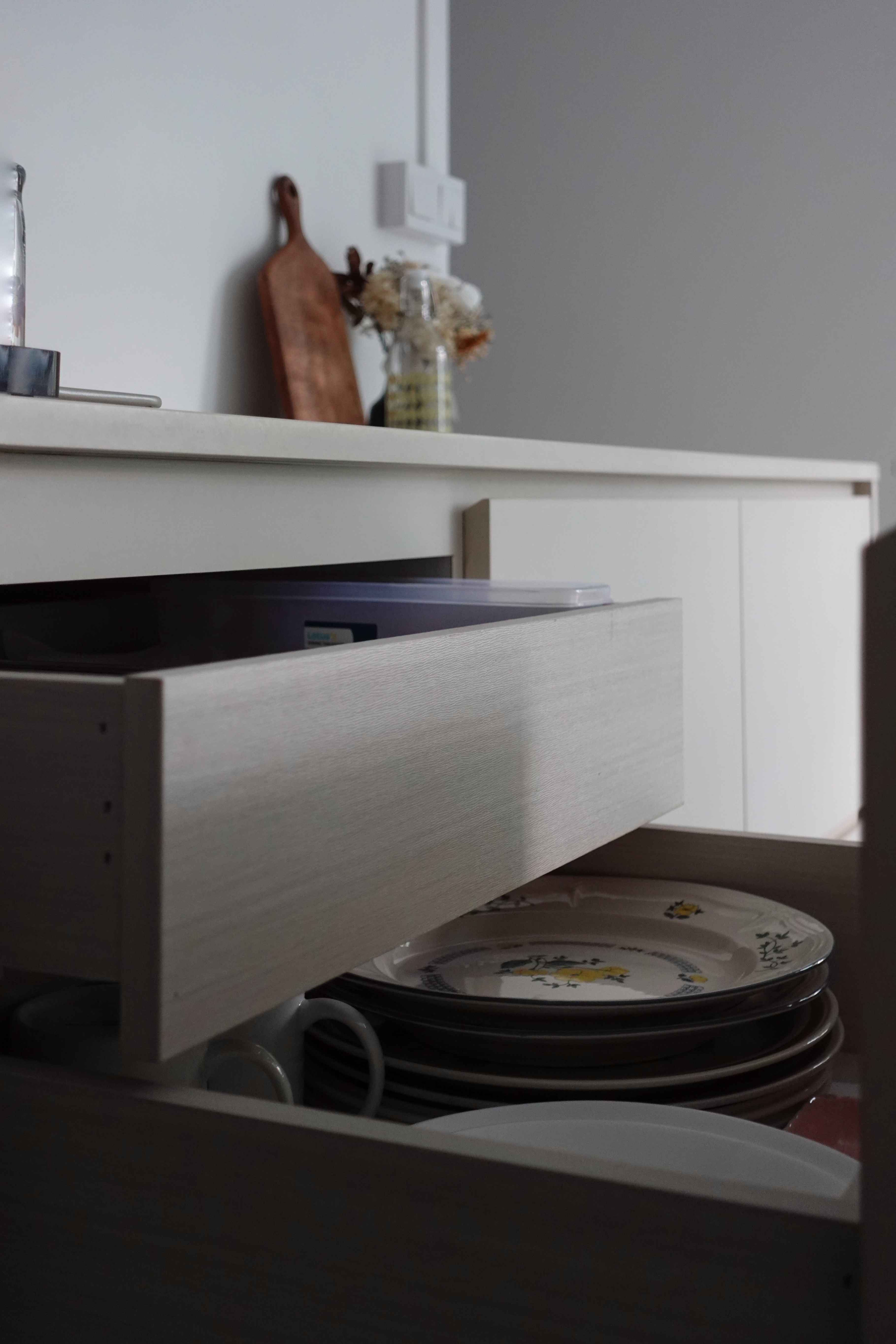How we kept our dining room visually clutter-free - Kitchen drawer, open drawer, plates, decorative plates, kitchen