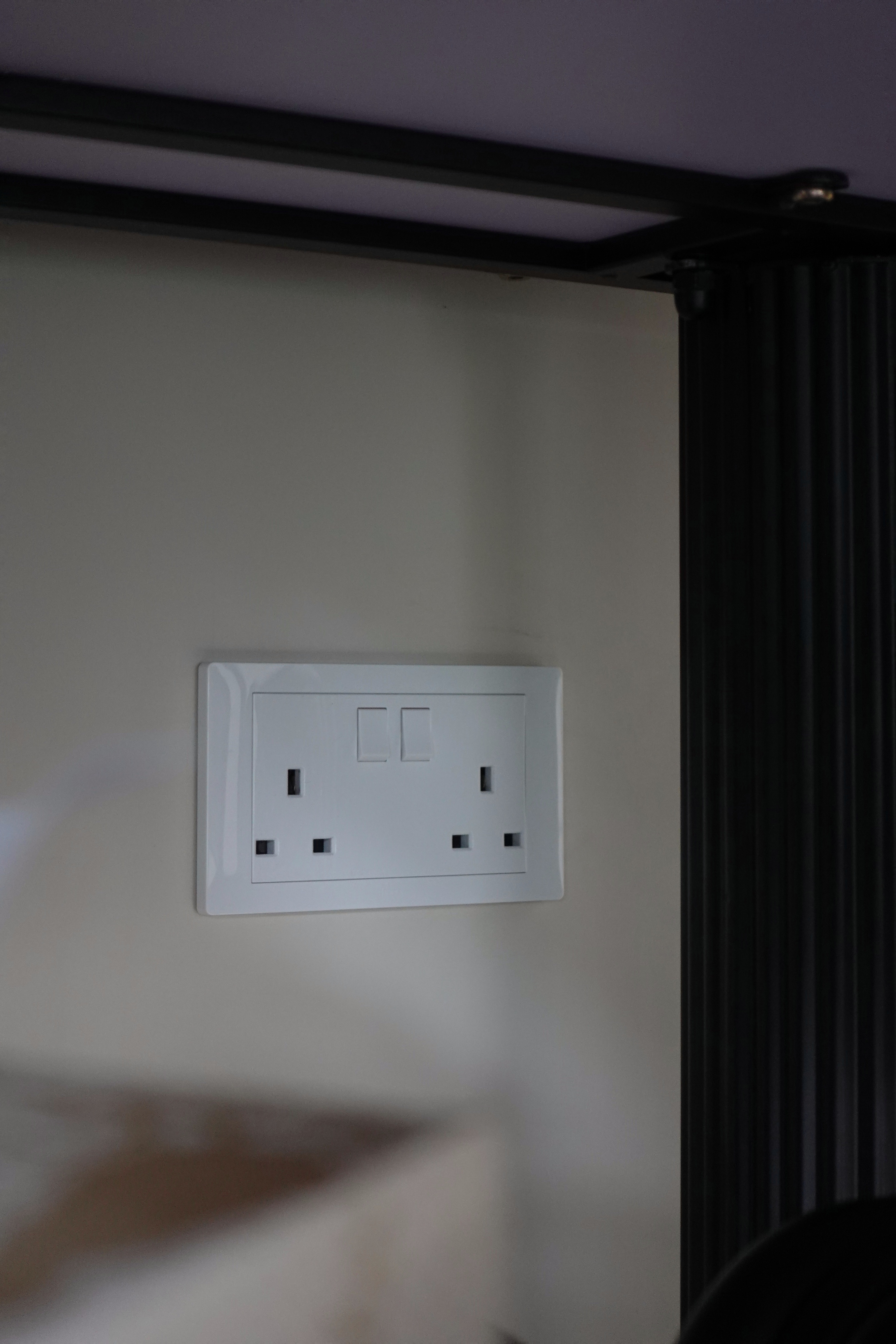 How we kept our dining room visually clutter-free - White electrical outlet, light switch, wall-mounted fixture, modern