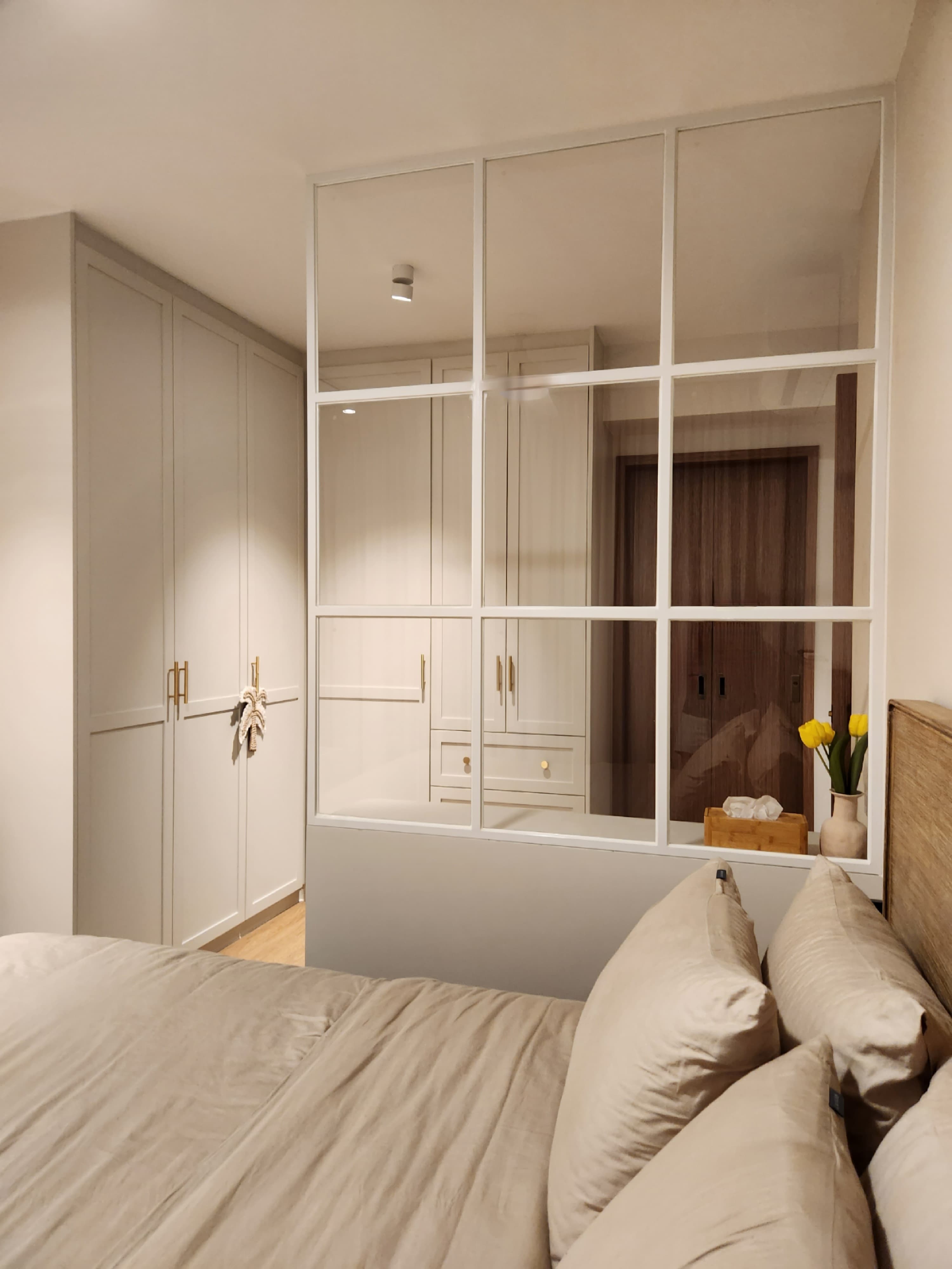 Restful Retreat in Our Neutral-Toned Master Bedroom - Cream-colored bedroom, beige bedding, modern design, large window