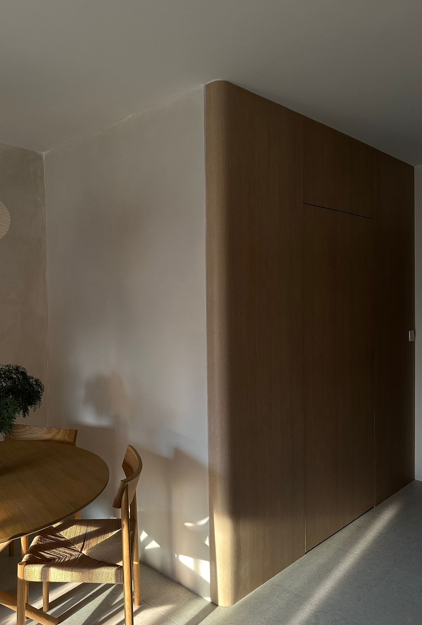 Welcome to our home - be greeted from our minimalist entryway - Wooden dining table, minimalist design, natural light, modern