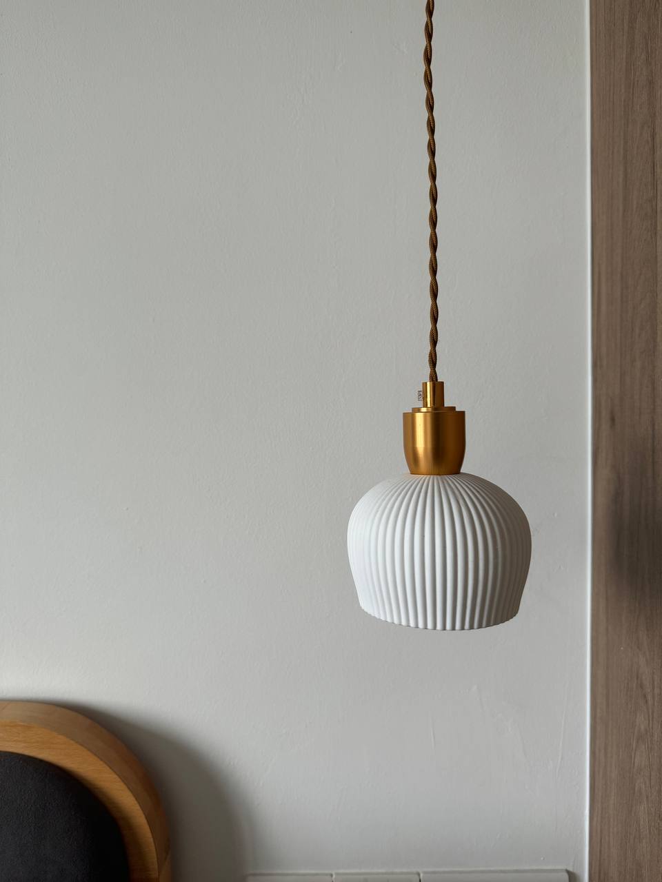Reimagining Relaxation: Our Home Staycay - White pendant light with gold accents, wooden frame, textured design, modern