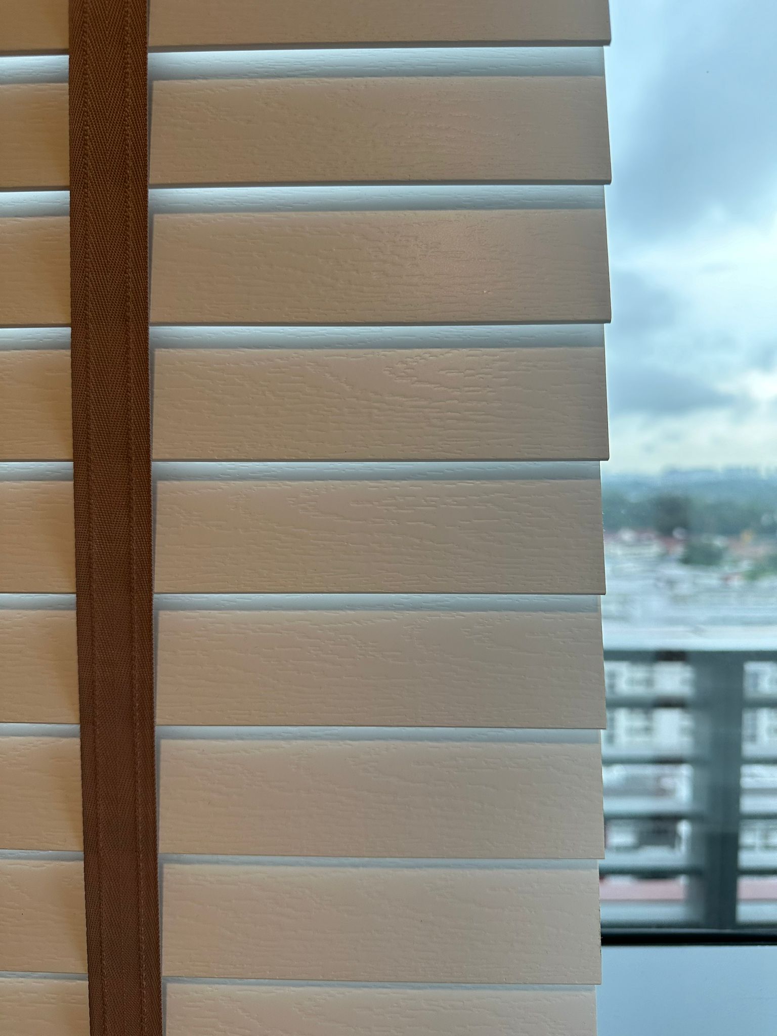 Bedroom: How to create the perfect bedroom for sleep  - Brown textured strap, beige horizontal blinds, urban cityscape view