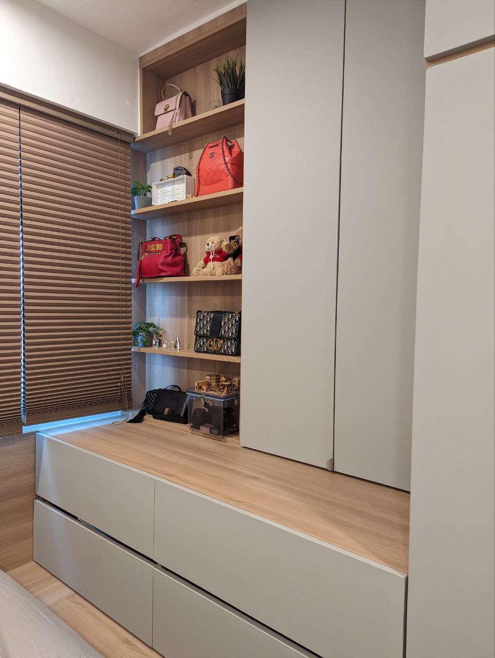 A Cosy Sanctuary: Rise and Shine! - Wooden shelves, modern design, stylish decor, neatly organized, multiple bags, pink