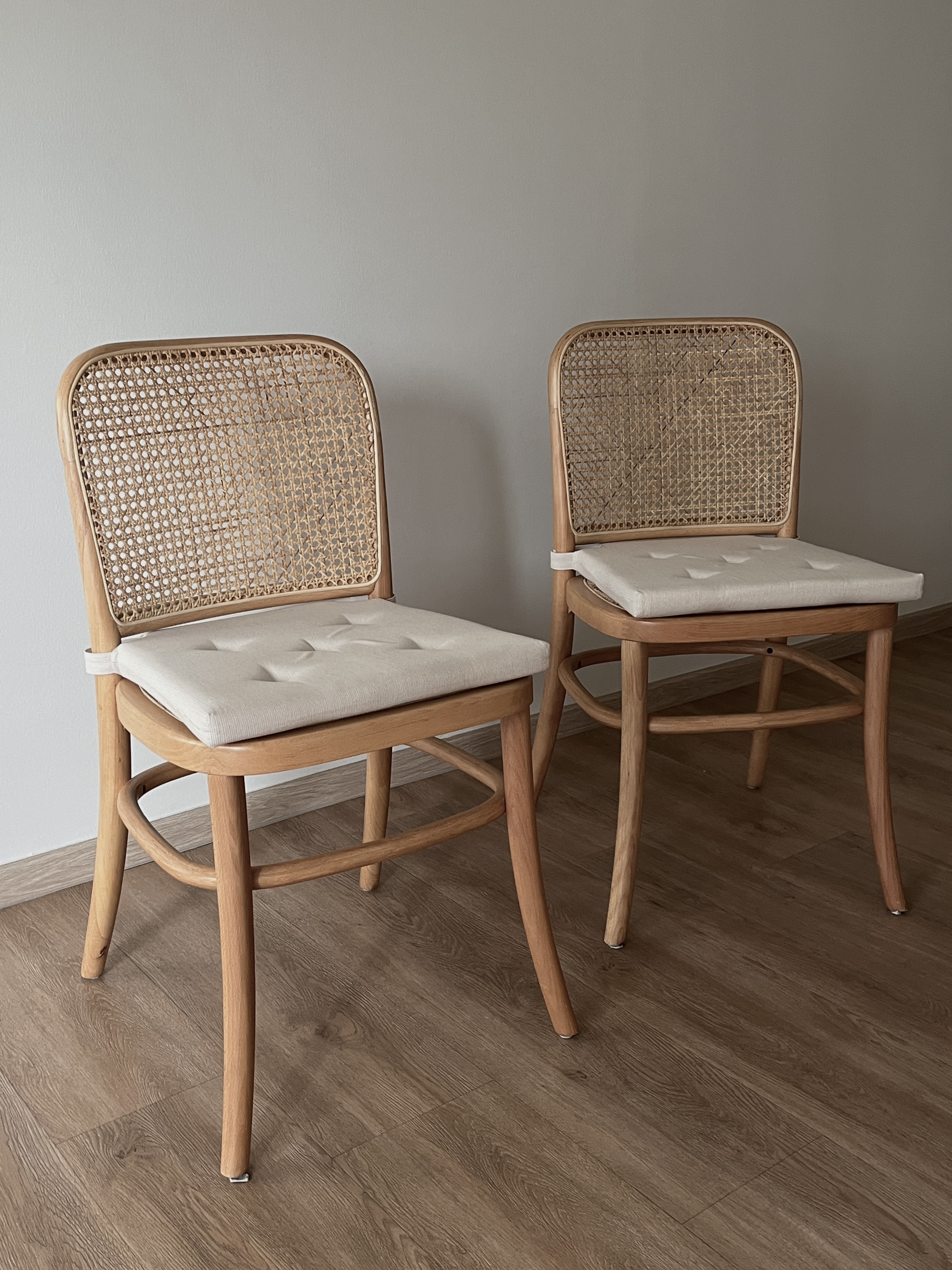 Dining Space: cafe vibes at home - Wooden chair with woven backrest, light beige cushioned seat, natural wood finish, curved