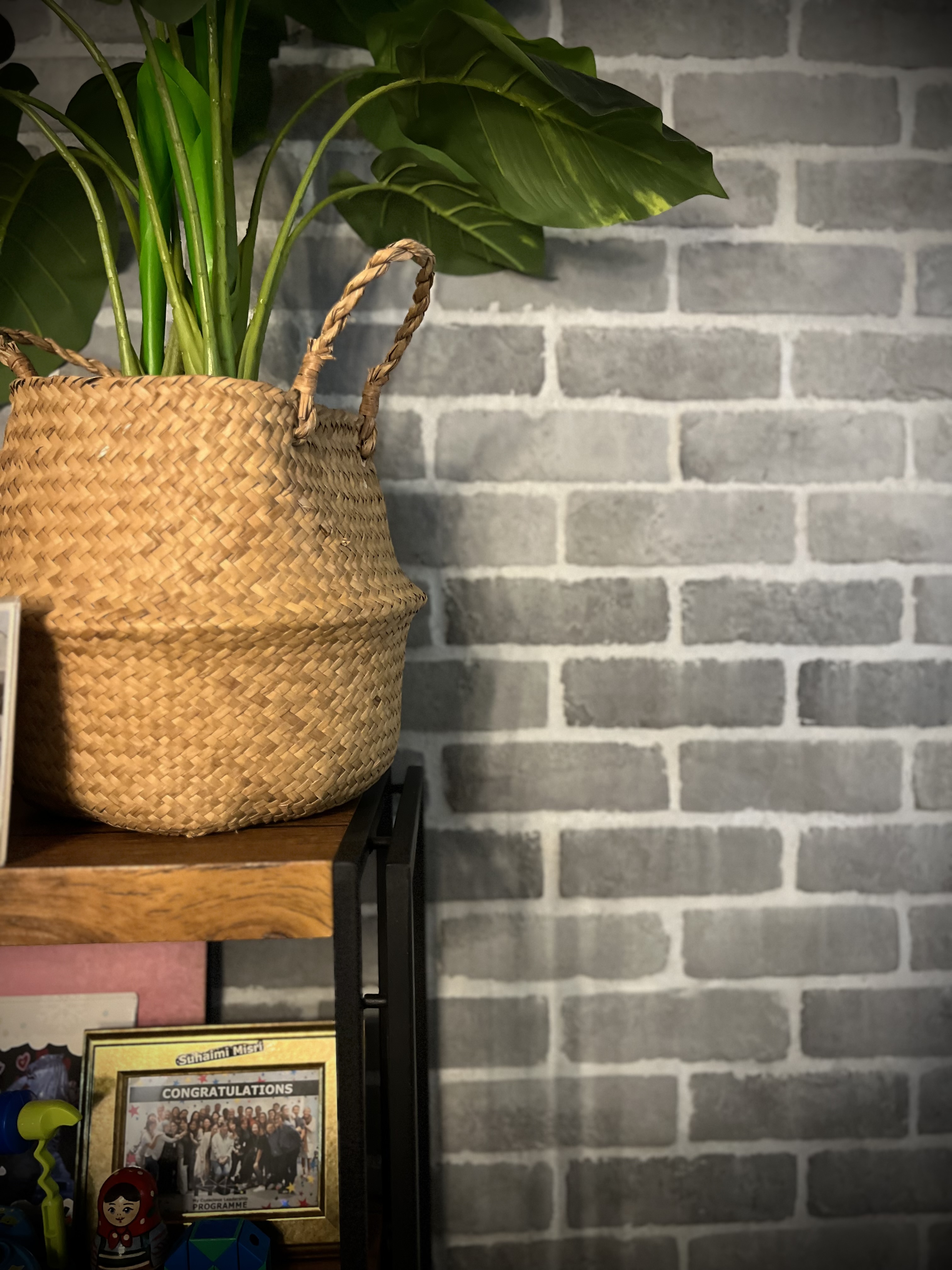 Dining Space: More than just meals - woven basket, green plant, rustic wall, brick wall, indoor setting, cozy atmosphere