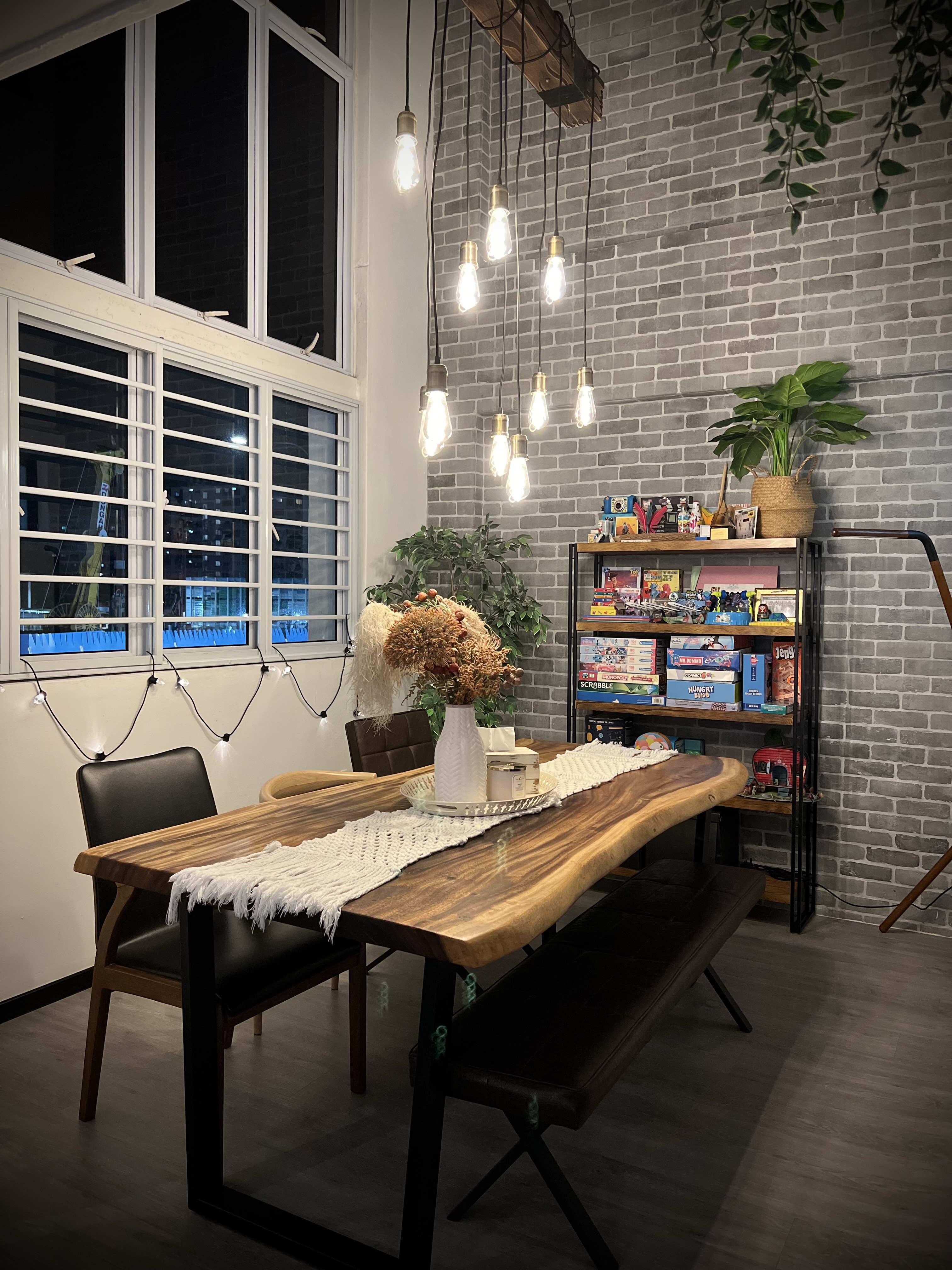 Dining Space: More than just meals - Modern dining room, cozy ambiance, rustic brick wall, hanging light bulbs, wooden dining
