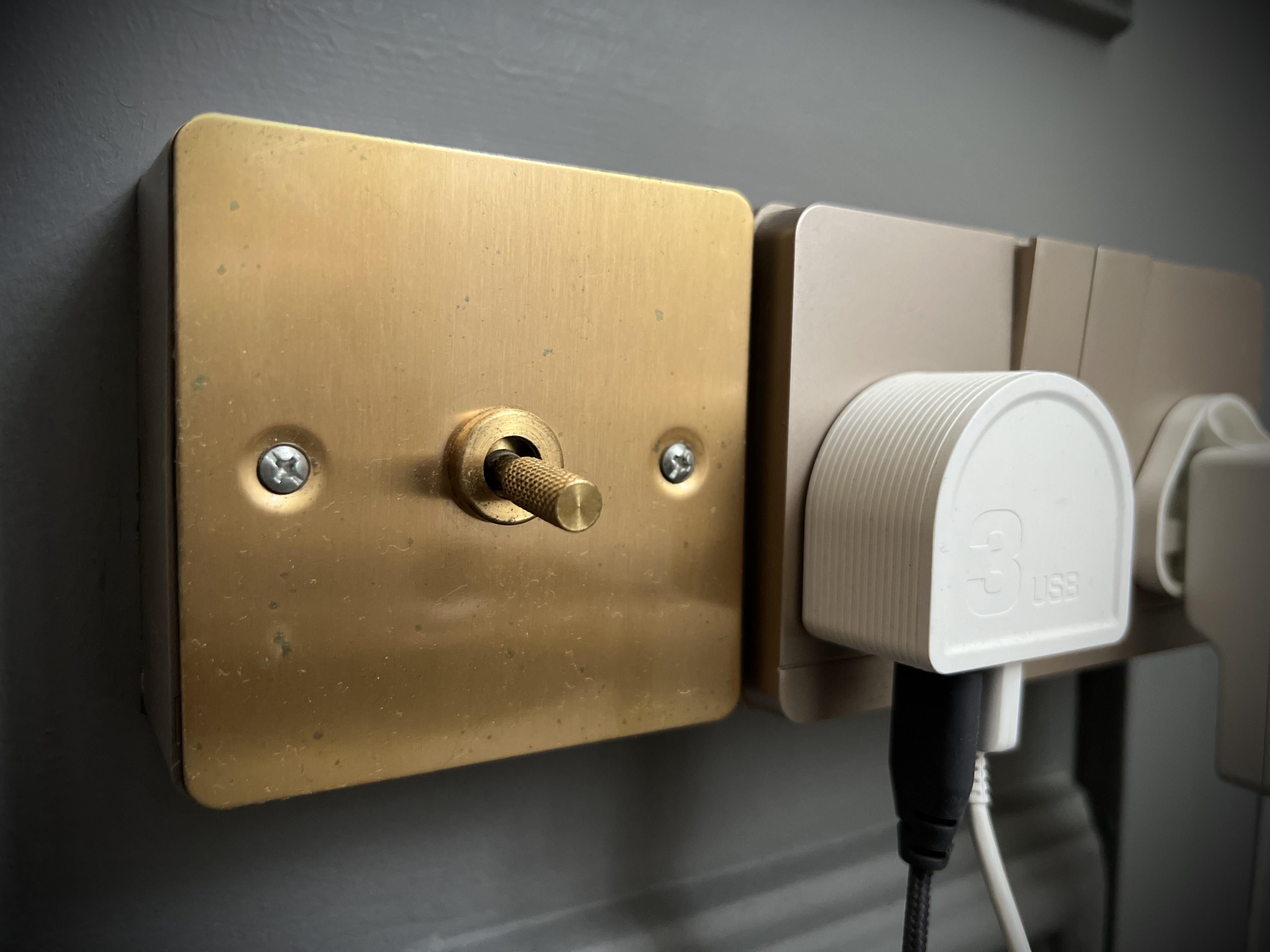 Bedroom: White, Gold and Grey Colour Scheme - Gold lock plate, brass hardware, screw, wall outlet, electrical plug