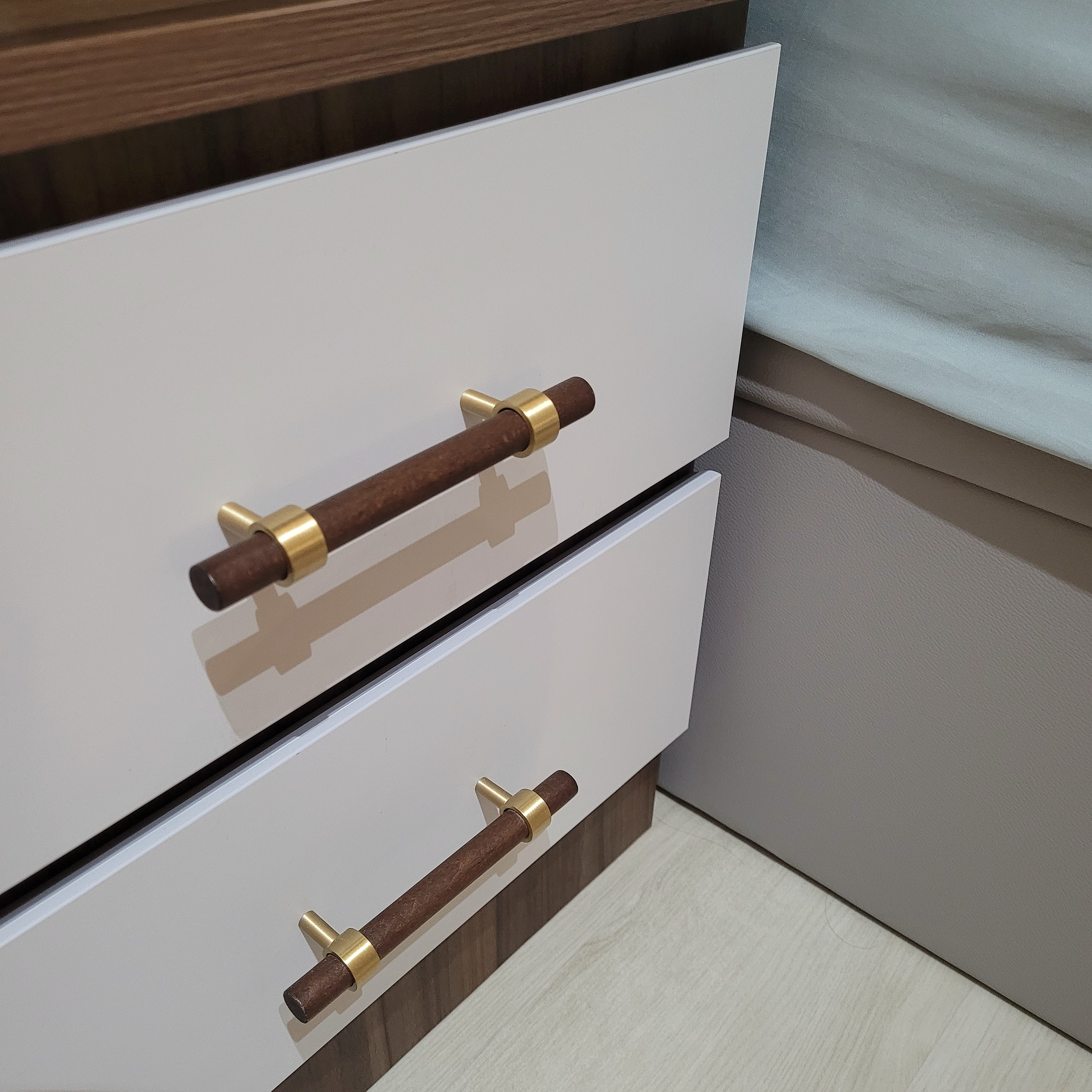 Our serene, cozy, and functional master bedroom - Wooden drawer handles, gold accents, minimalist design, sleek appearance