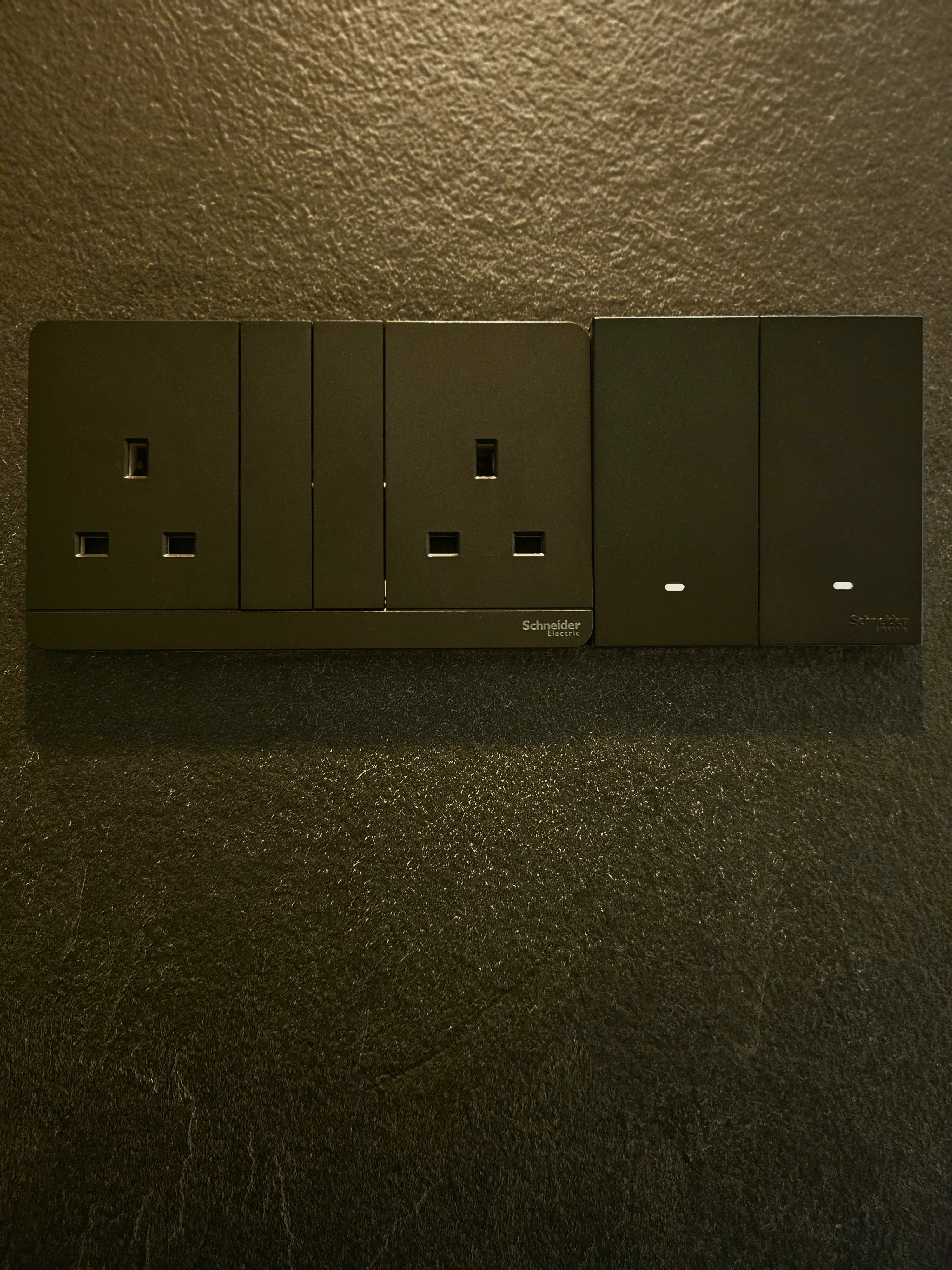 Bedroom: Our Sleep Haven - Schneider Electric panel, dark textured wall, modern design, black panel, three outlets, recessed