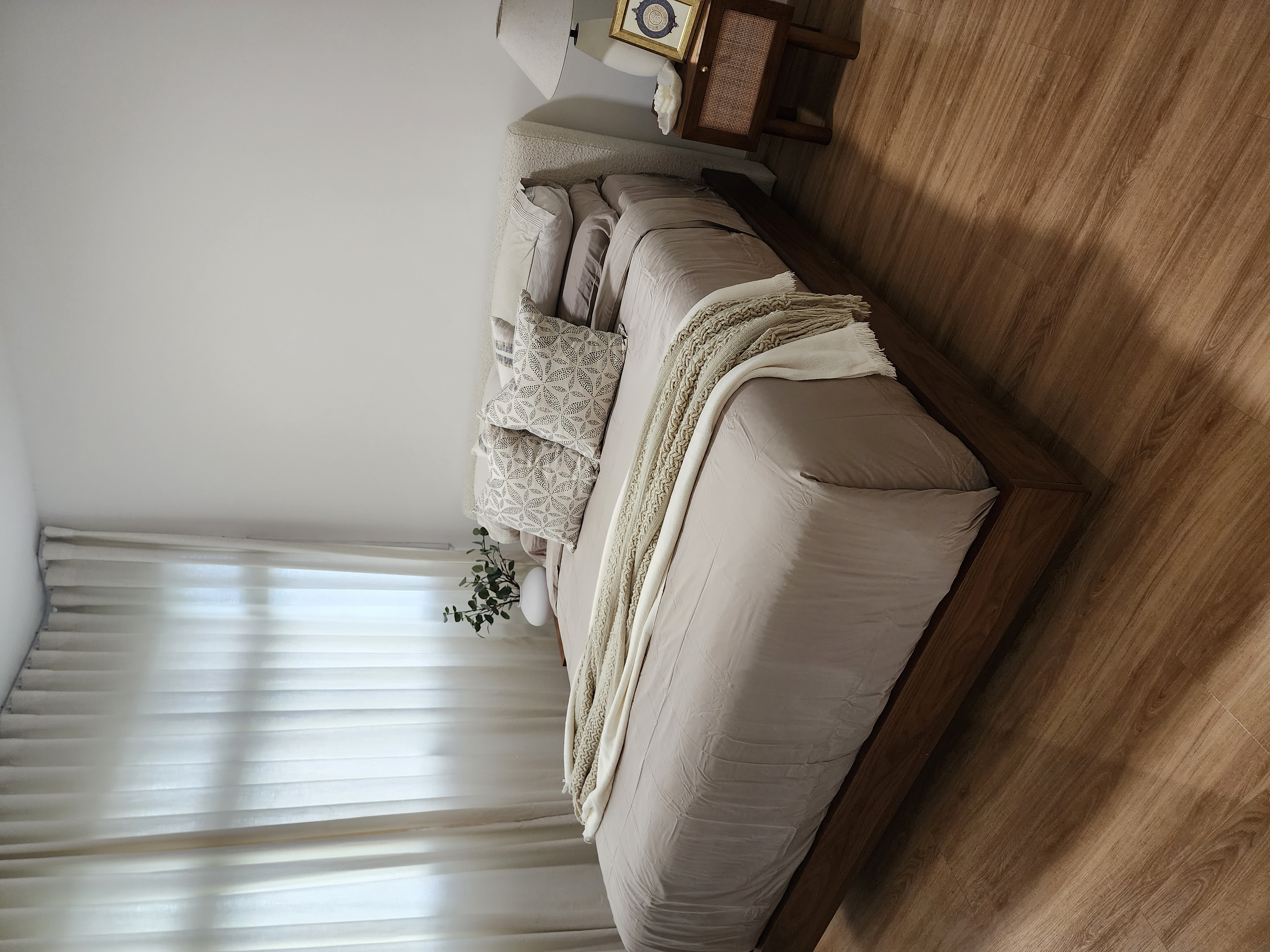 Master Bedroom - Simplicity in slumber - Wooden floor, soft lighting, cozy atmosphere, neutral color palette, plush bedding