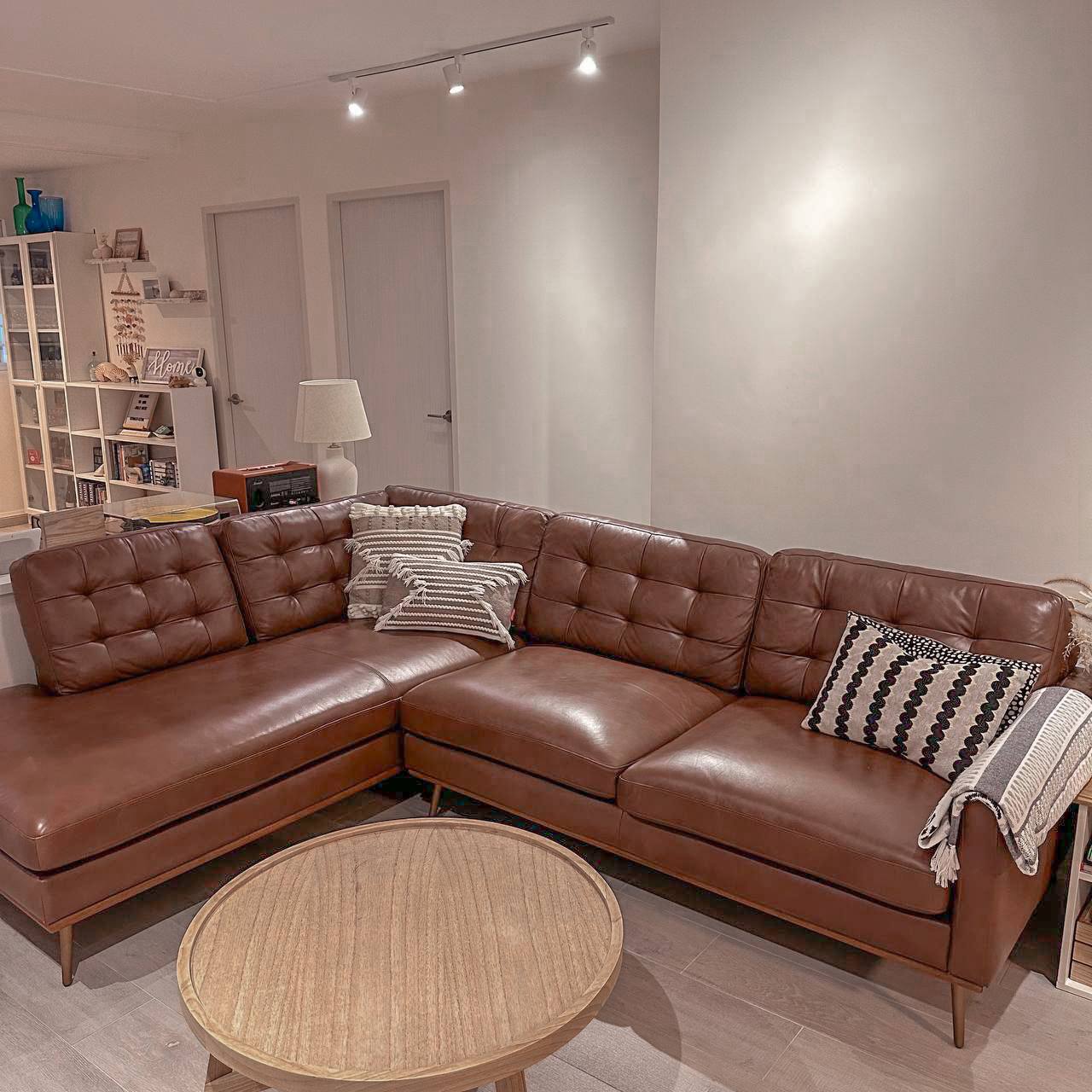 Farmhouse Living Room with Brick Walls! - Leather sofa, brown leather, modern living room, cozy seating, contemporary decor