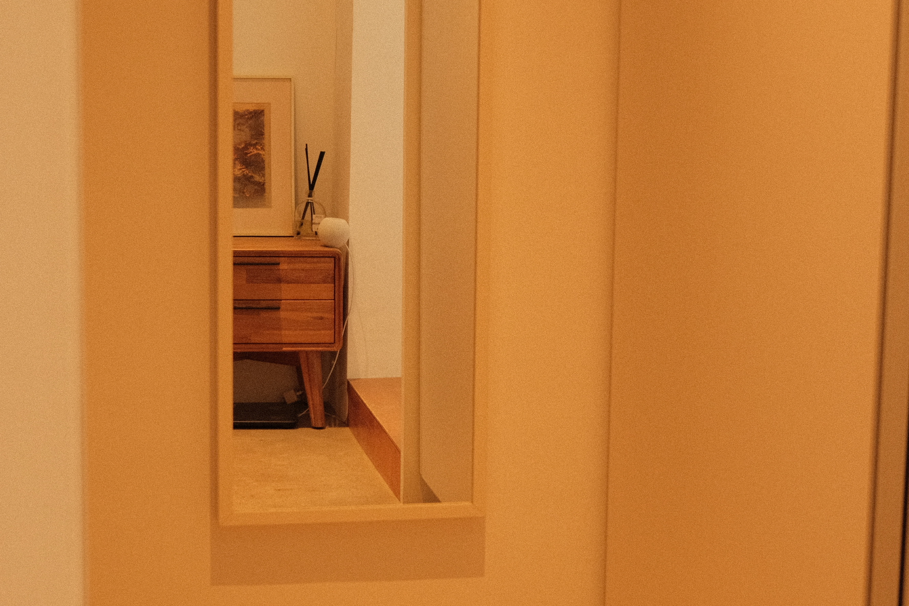 Our compact bedroom layout and accessories  - Wooden dresser, framed artwork, abstract painting, minimalist decor, soft