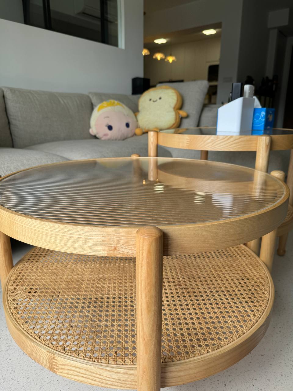 The Perfect Corner to be a Couch Potato - Round wooden table, woven chair, cozy living room, plush toys, soft lighting
