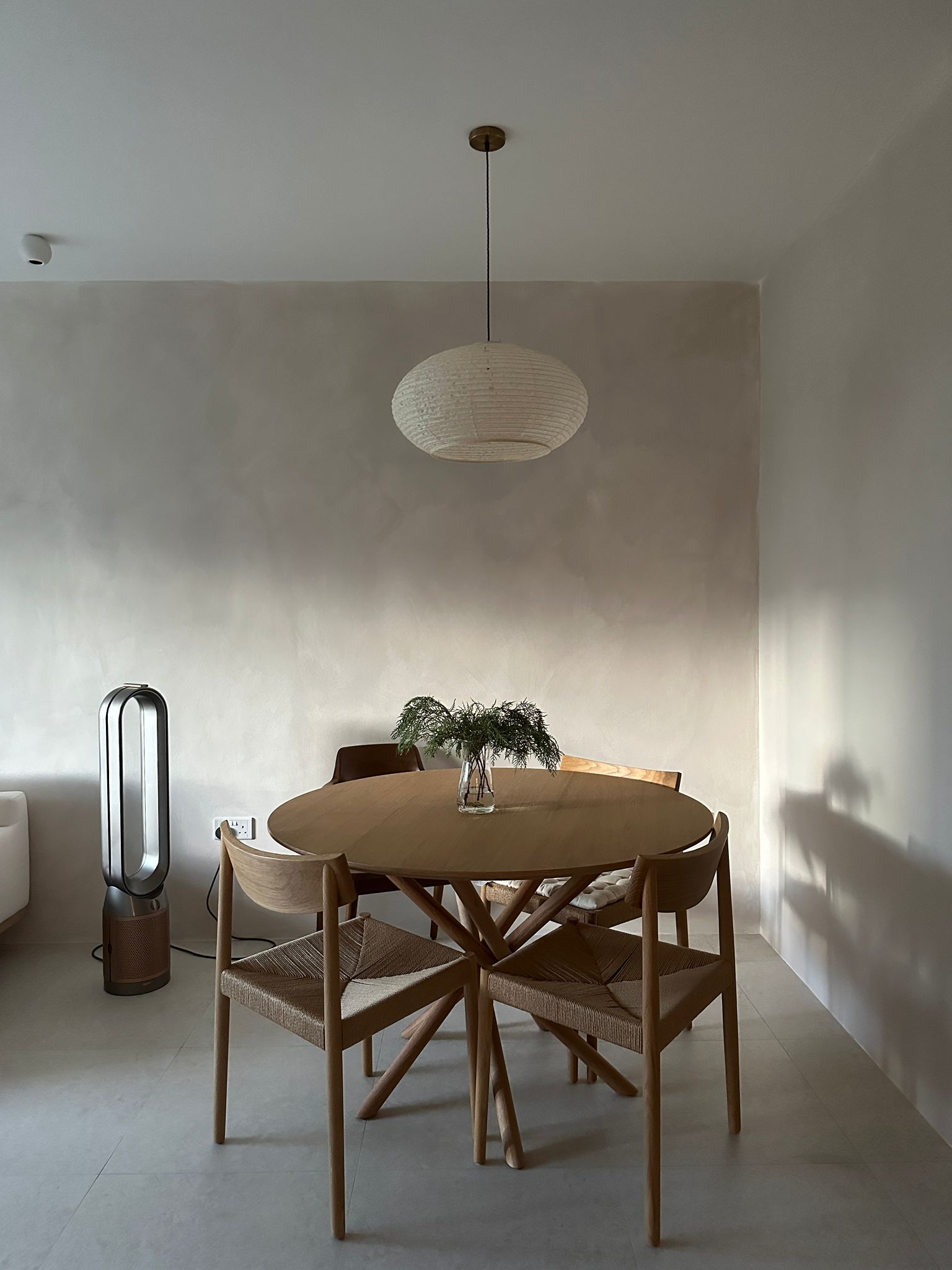 our cozy Japandi dining corner  - Modern minimalist dining room, sleek dining table, natural wood chairs, soft ambient