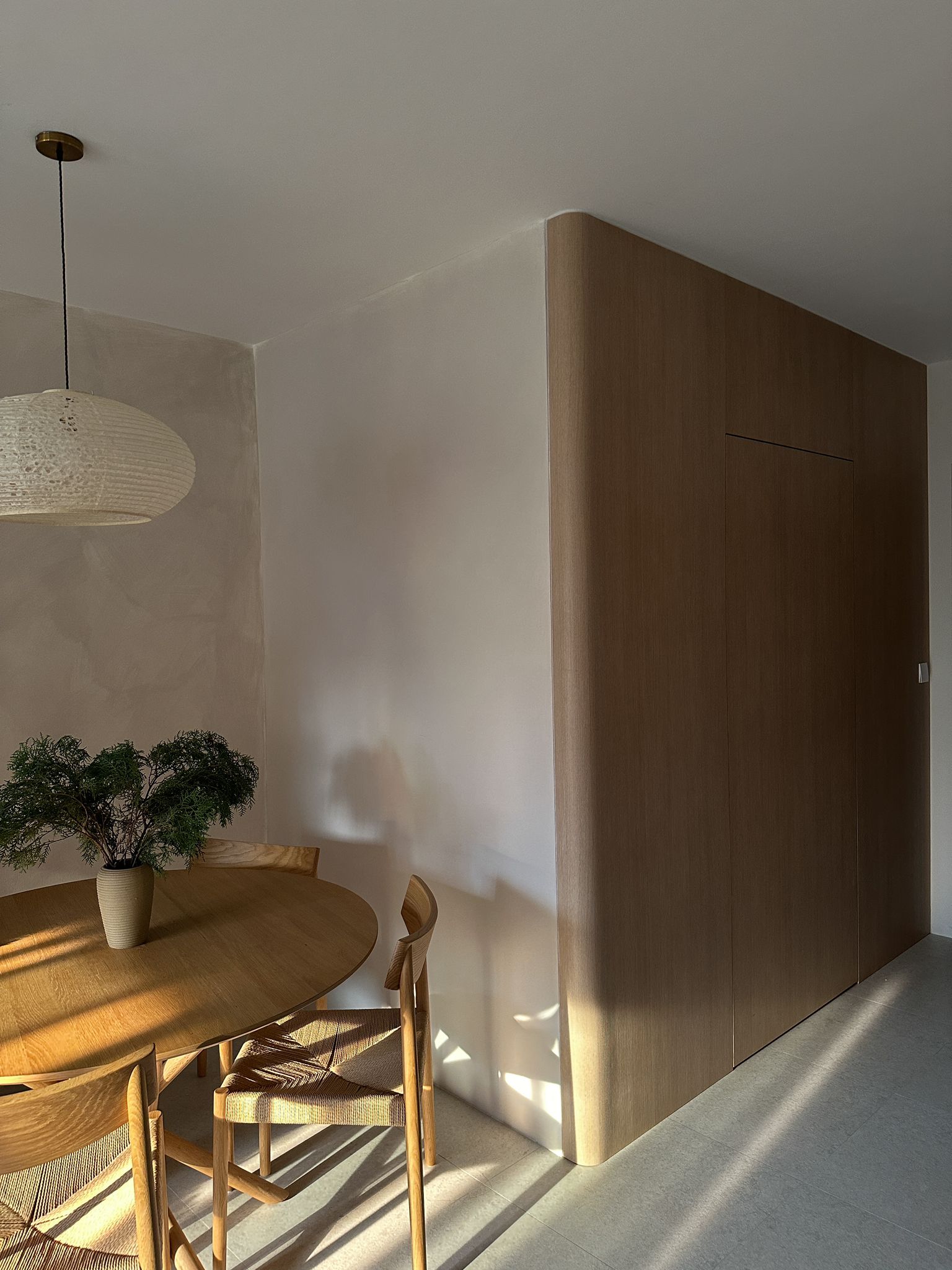 our cozy Japandi dining corner  - Wooden dining table, modern kitchen, minimalist design, natural light, round table, wooden