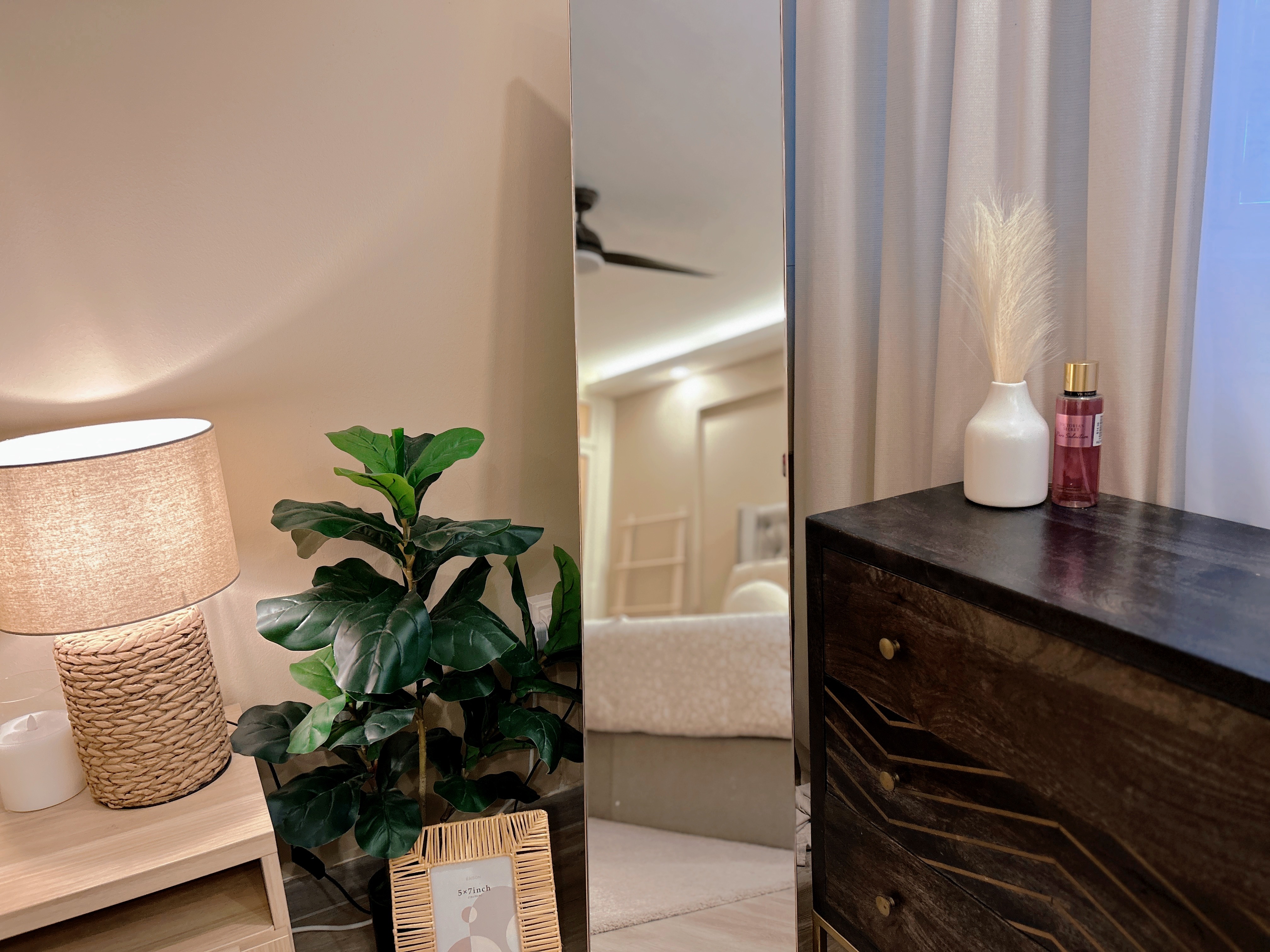 Welcome to our tranquil bedroom sanctuary, where relaxation awaits! - Light beige wall, soft lighting, cozy atmosphere