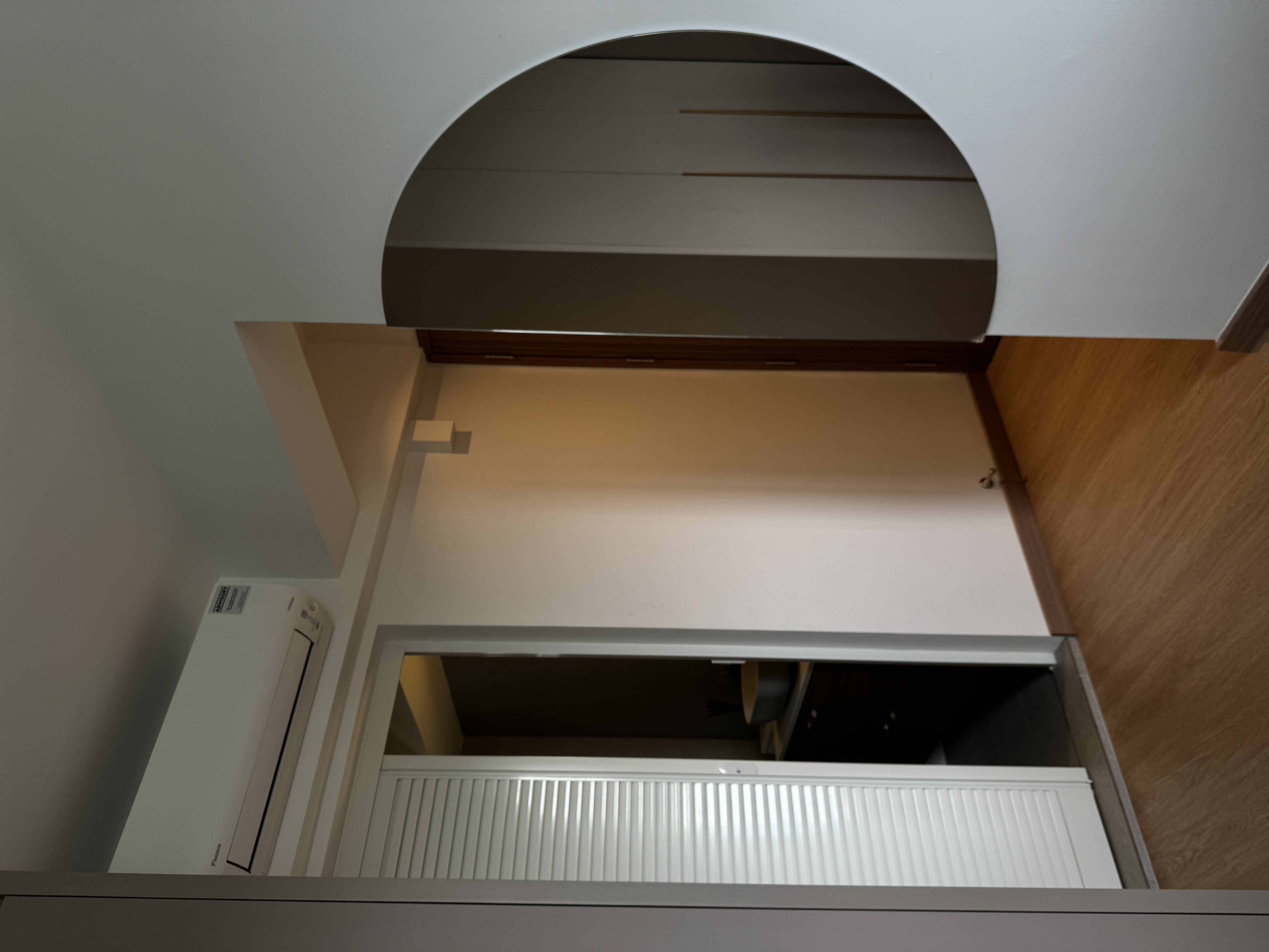 Simple Master Bedroom  - White refrigerator, arched ceiling, wooden wall, recessed lighting, white door frame, vertical