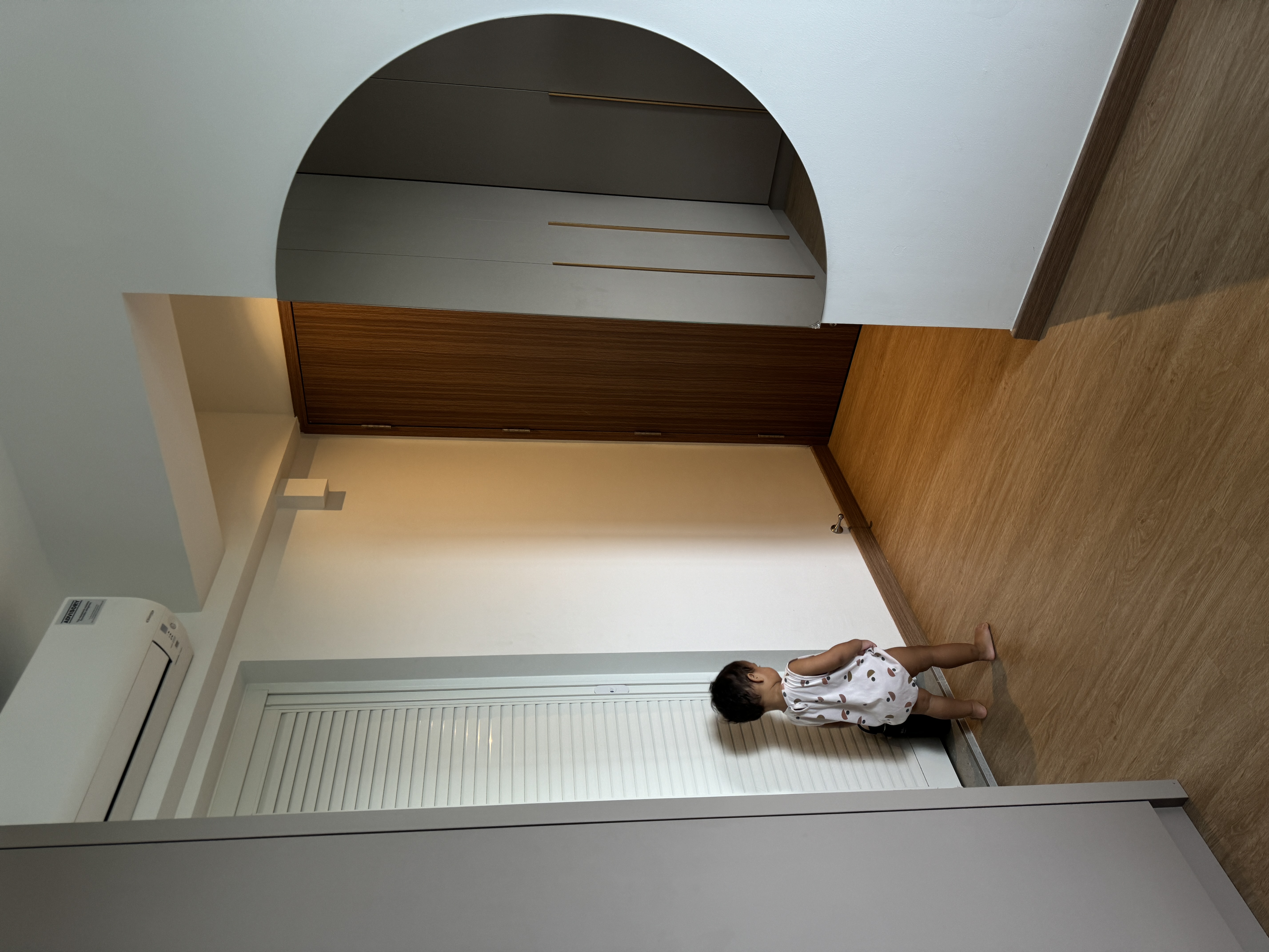 Simple Master Bedroom  - modern interior, minimalist design, child standing, wooden flooring, white air conditioning unit