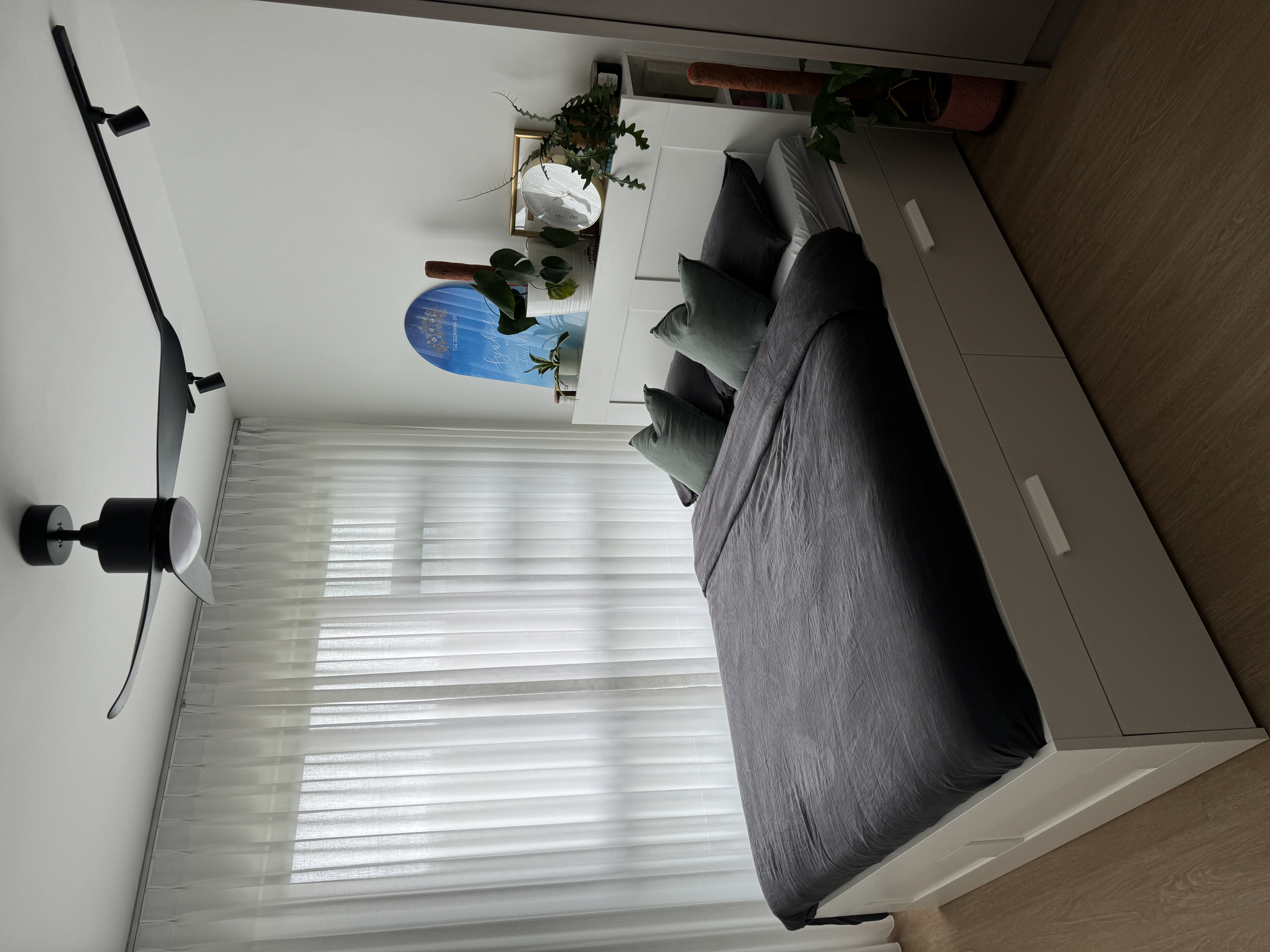 Simple Master Bedroom  - modern bedroom, minimalist decor, cozy atmosphere, large window, white walls, soft lighting, gray