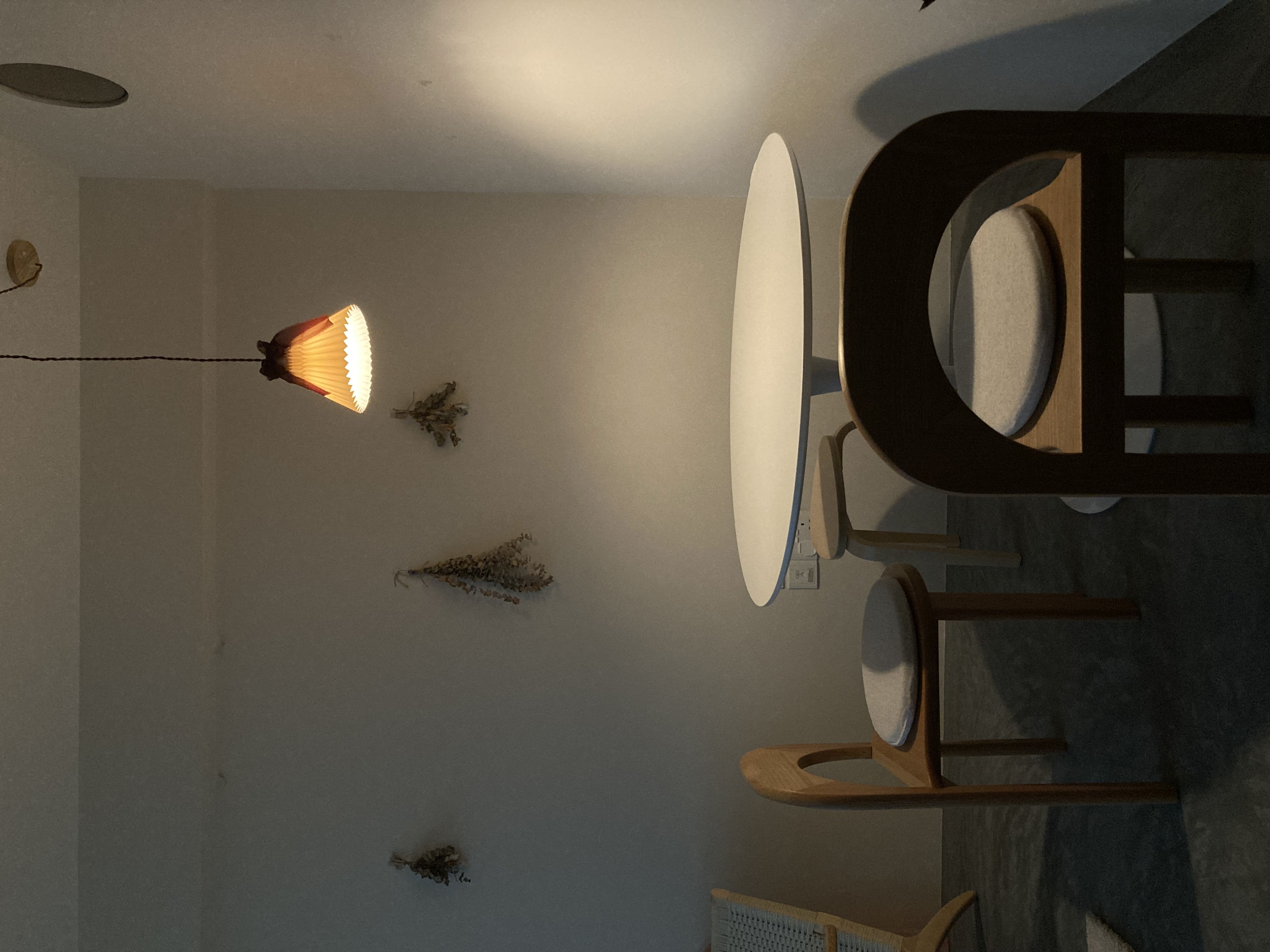 Living room transformed with mood lighting - modern minimalist decor, cozy room ambiance, warm lighting, abstract art