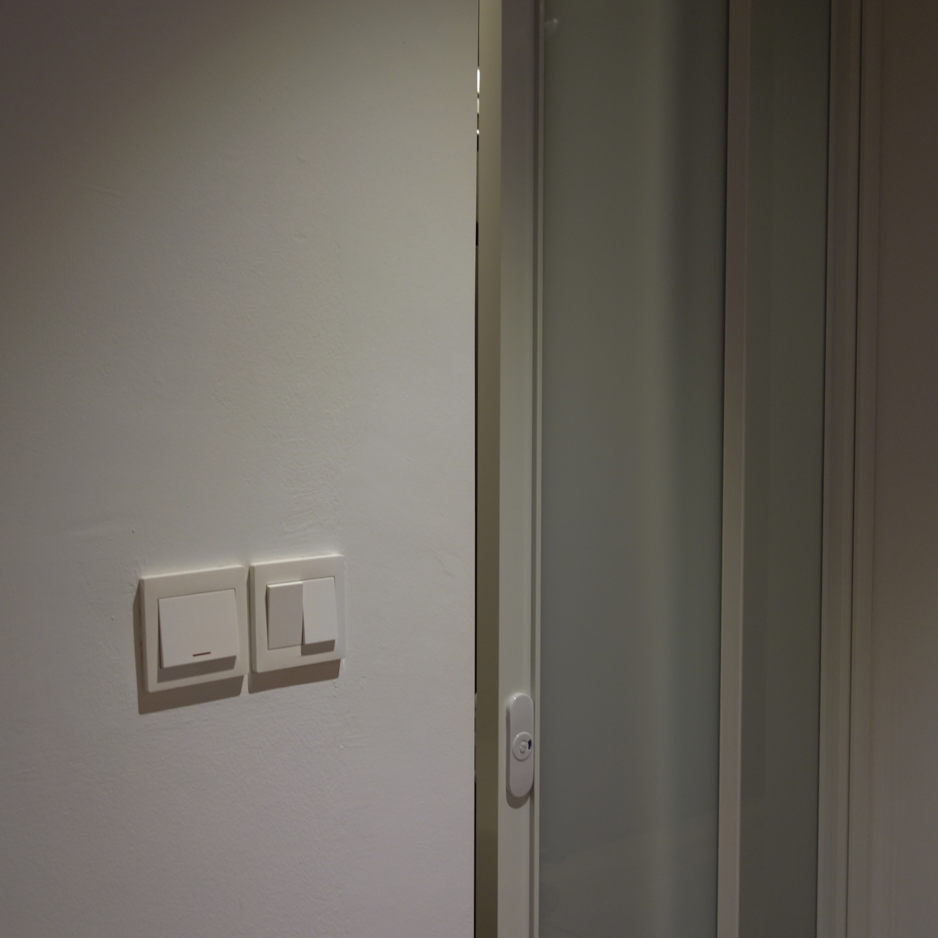 A cozy retreat: The master bedroom - Light fixture, light switch, white wall, minimalist design, modern decor, sleek lines