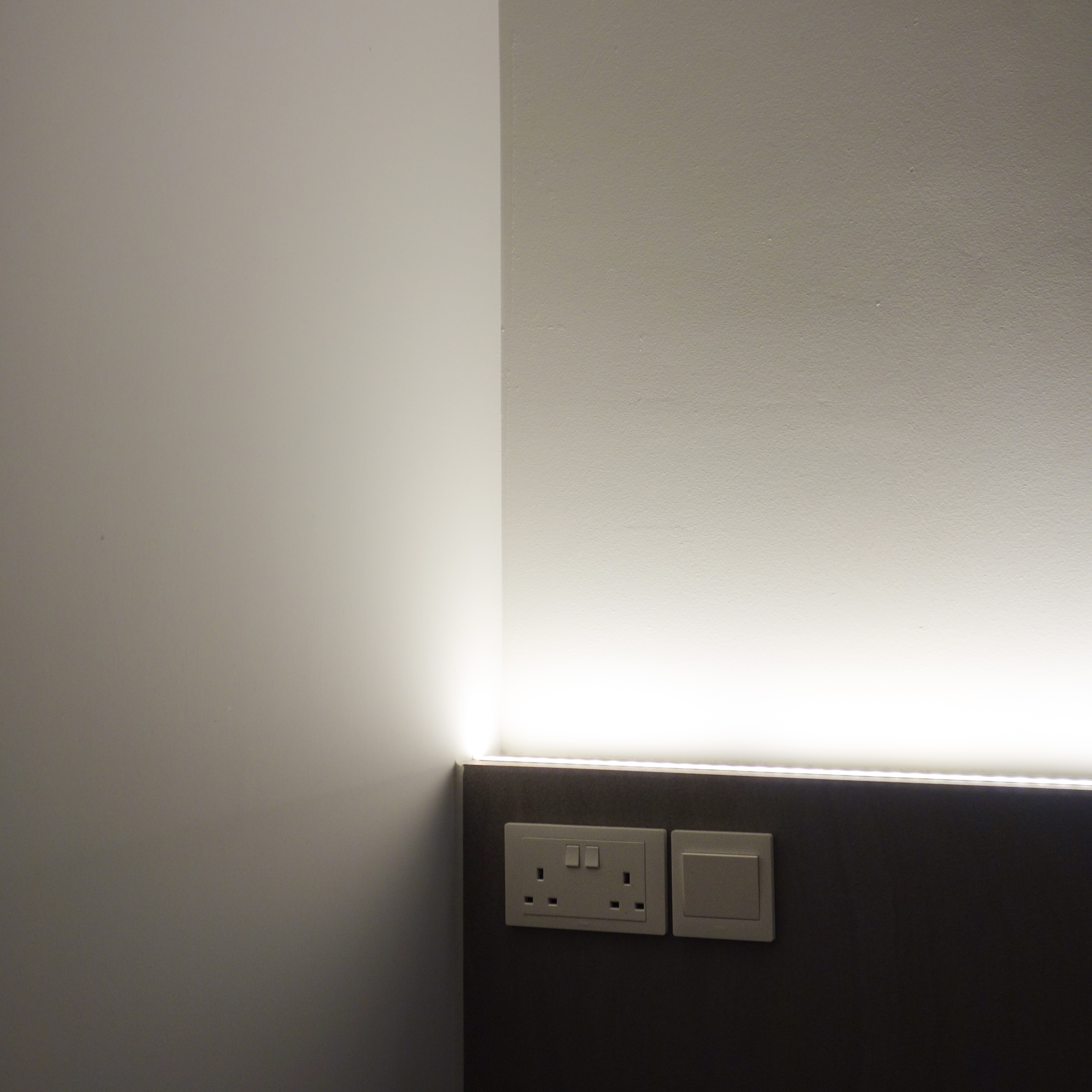 A cozy retreat: The master bedroom - White wall, minimalist design, modern decor, sleek lighting, wall-mounted electrical