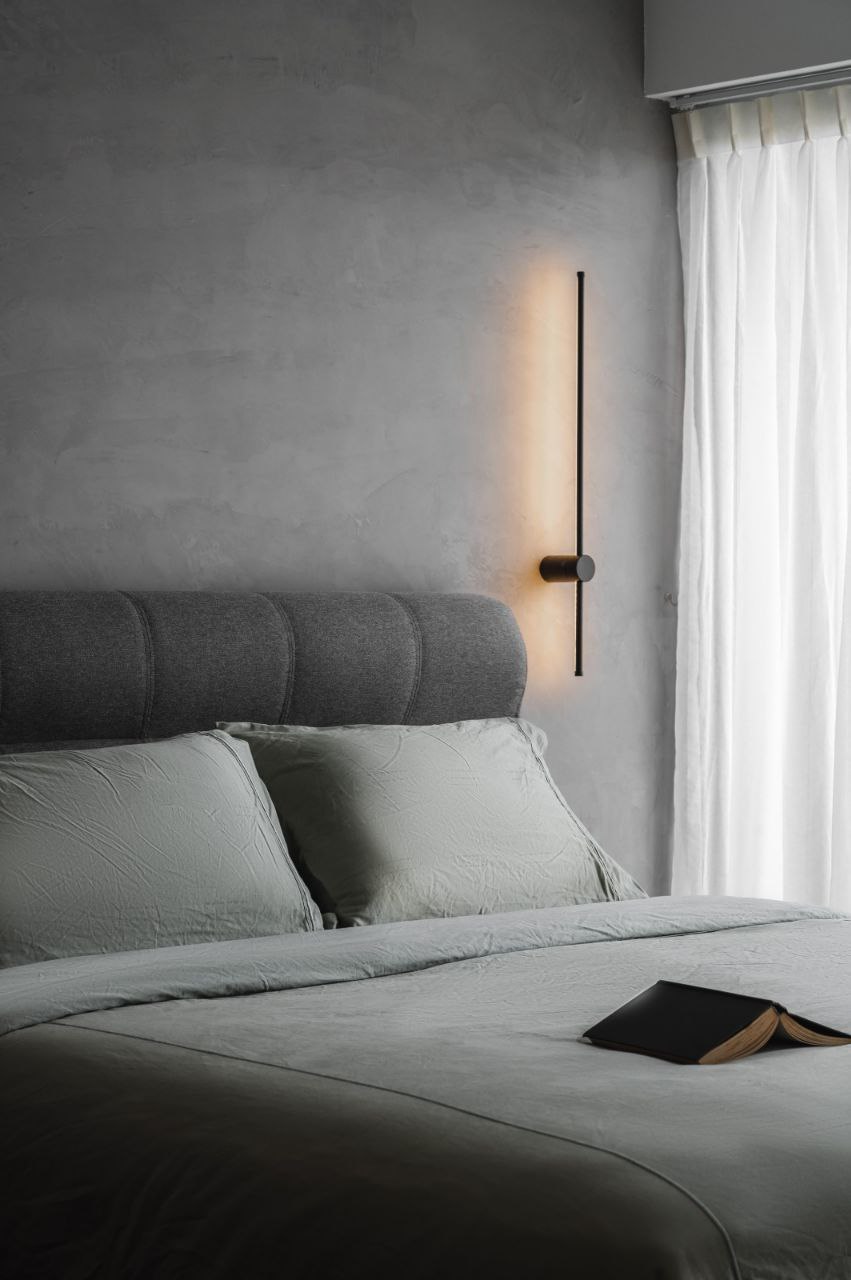 Bedroom: Zen Mode ON - Modern minimalist bedroom, gray upholstered headboard, soft lighting fixture, elegant bedside table
