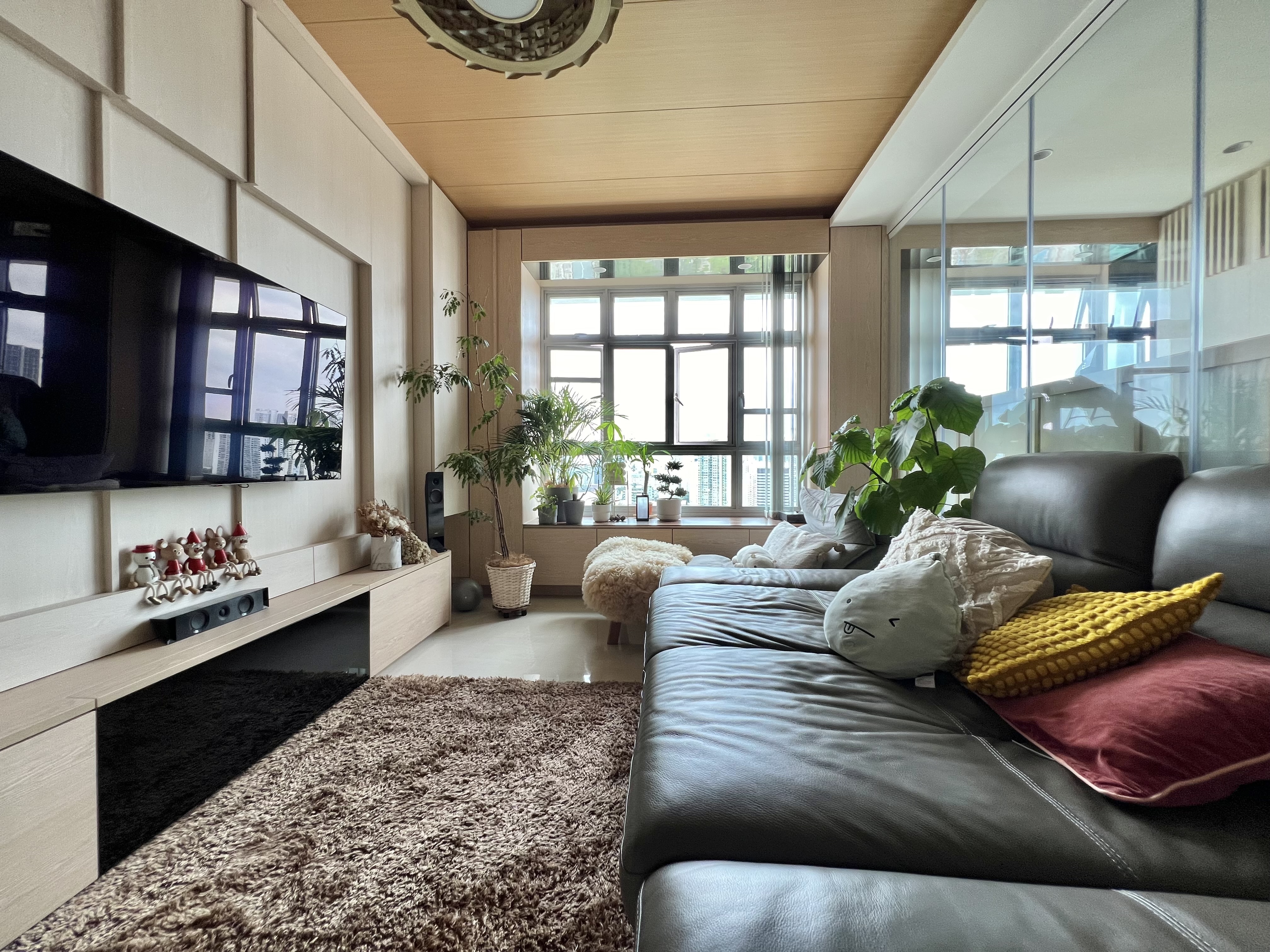 Living room as a room for plants too - Modern living room, cozy seating, large window, indoor plants, beige and brown tones