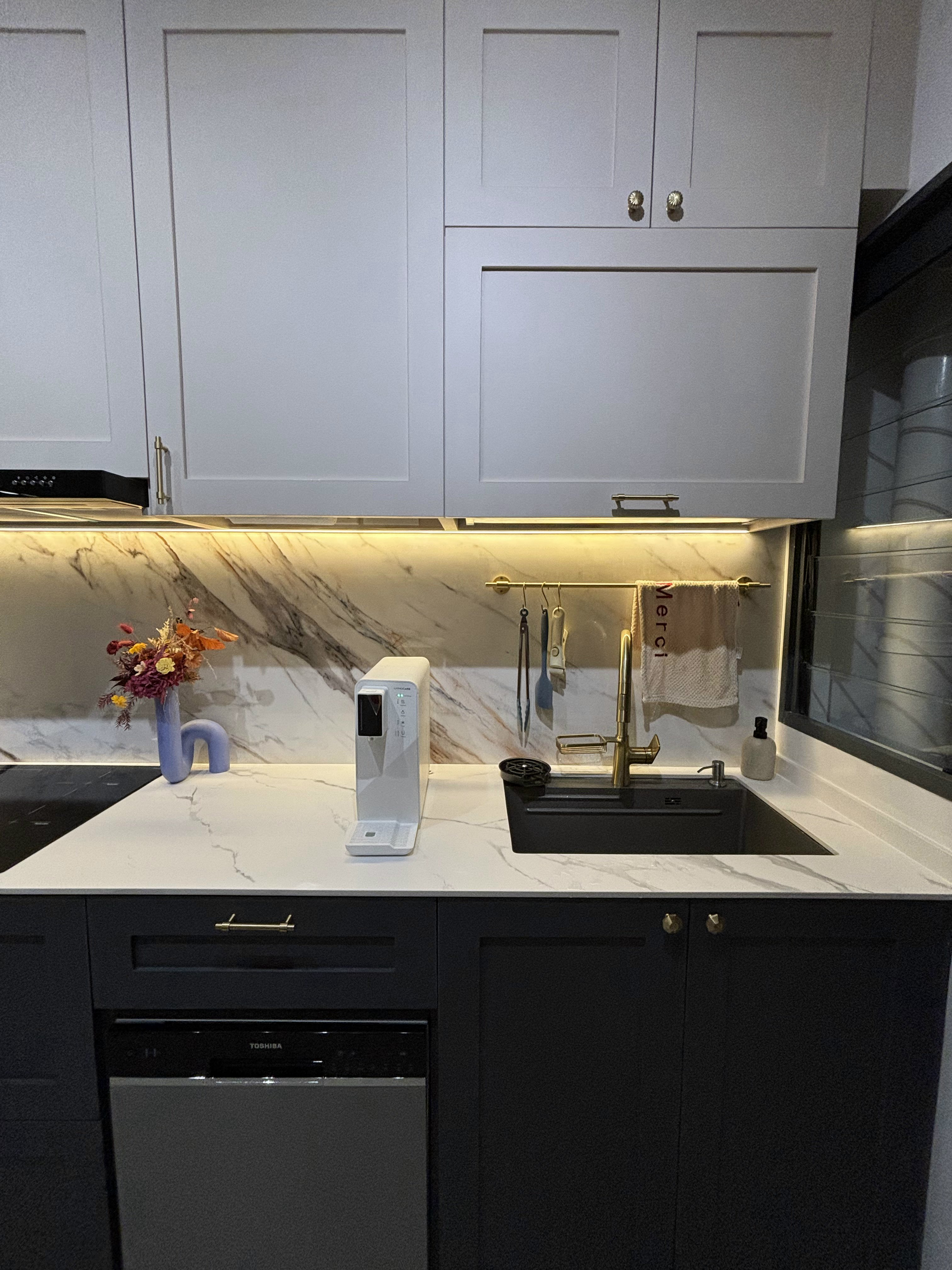 Our Favourite Features in the Kitchen - White kitchen cabinets, marble backsplash, modern sink, gold faucet, black