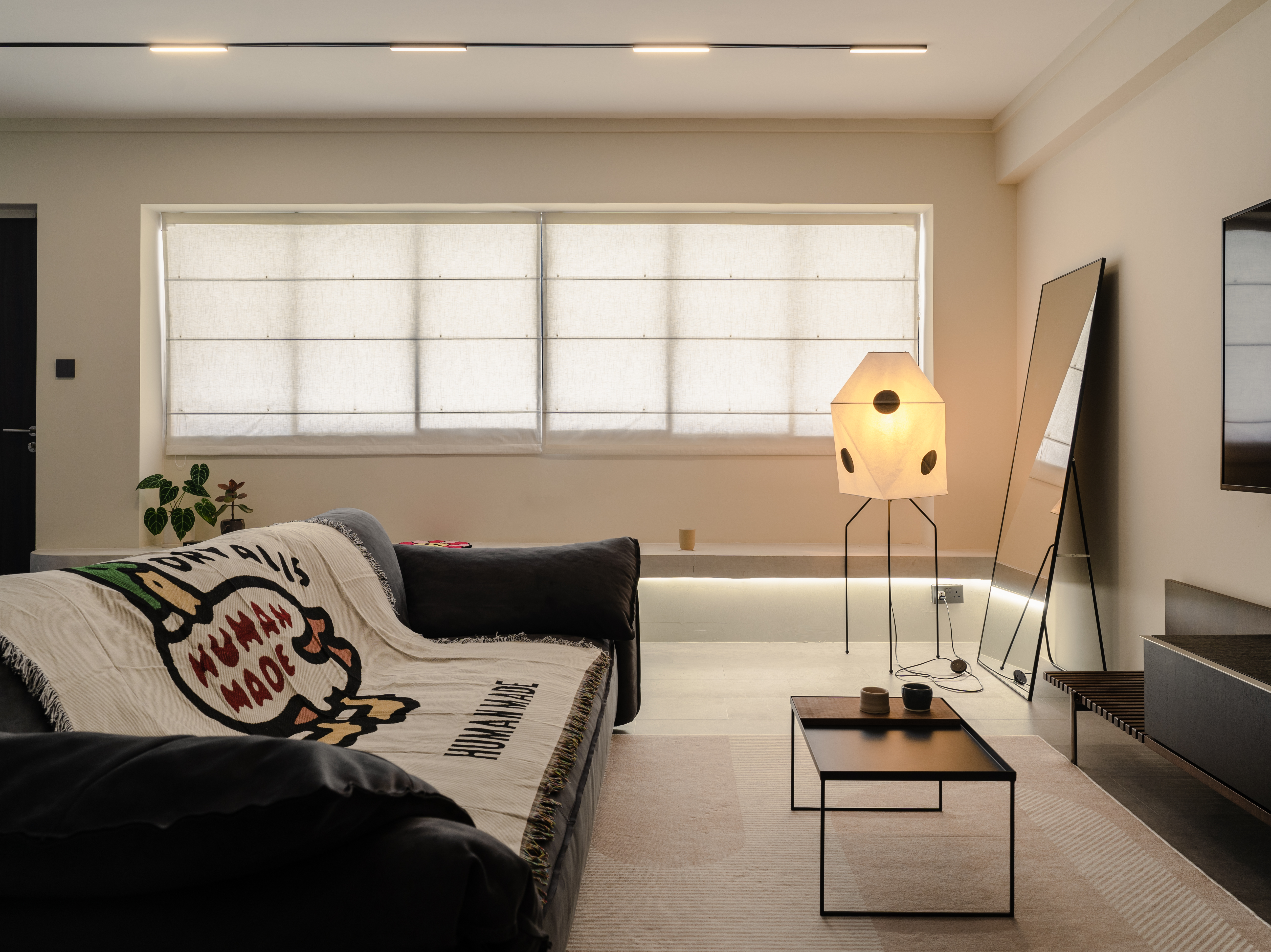 Our Living Area: A space for books, games and quirky clocks - Modern minimalist living room, cozy seating area, neutral color