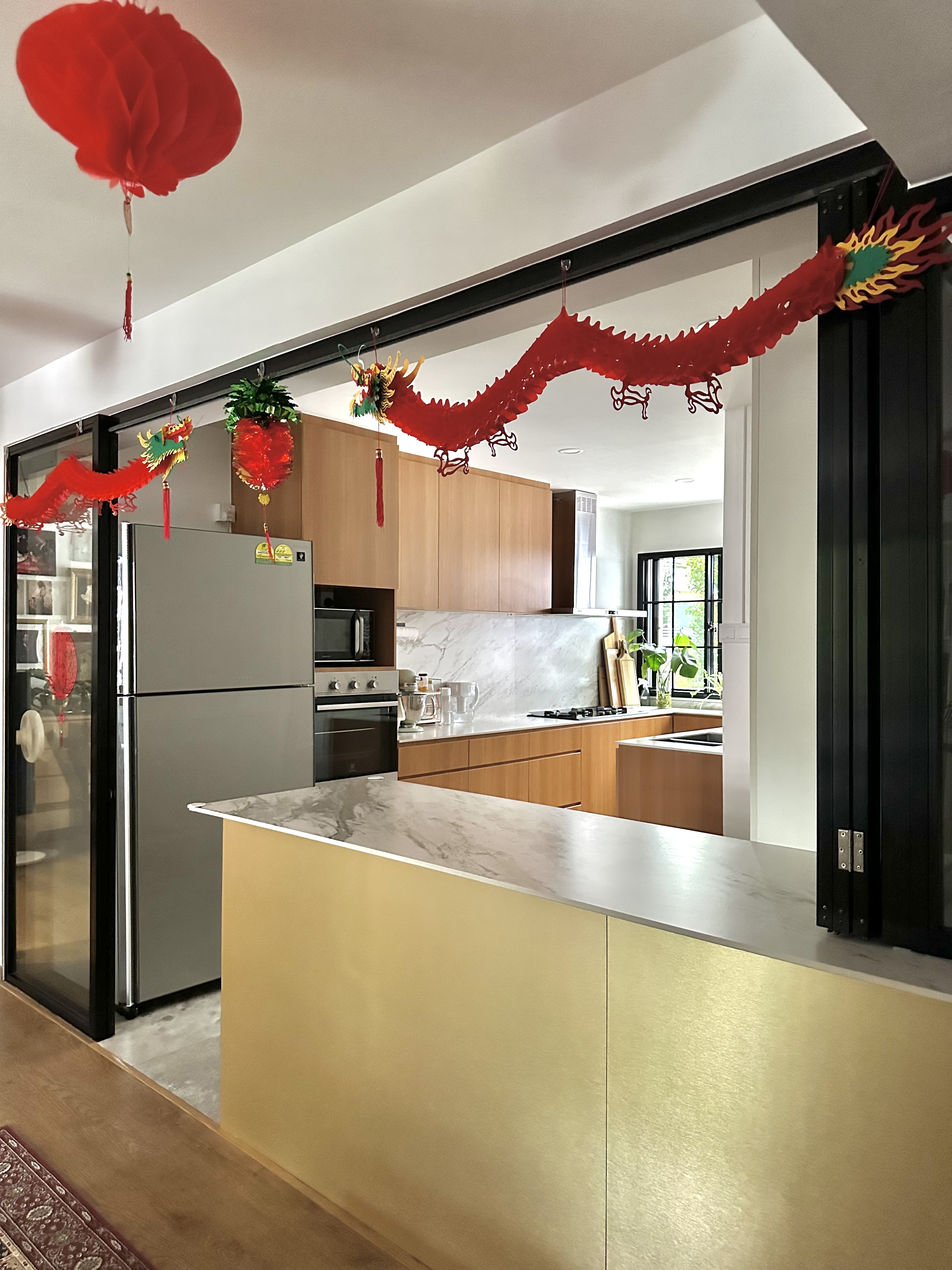 A Festive Home Ready to Welcome the Year of Dragon - Red dragon decorations, modern kitchen, festive atmosphere, Chinese New