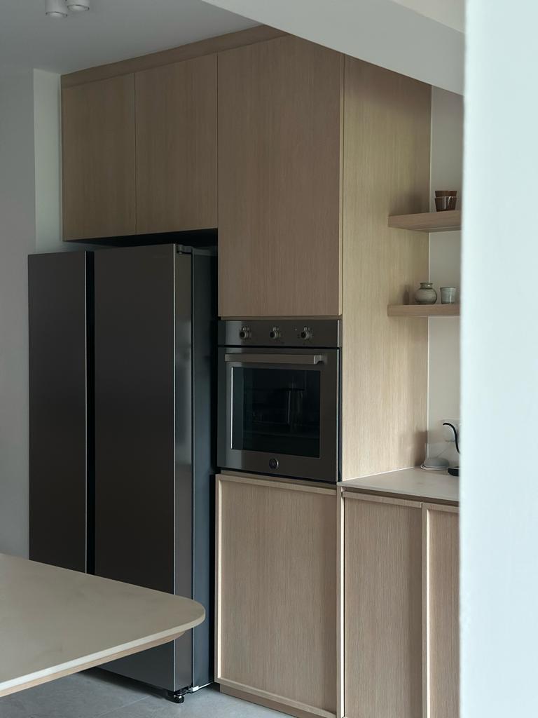 Our kitchen, the heart of our home  - Wooden kitchen cabinets, sleek refrigerator, modern oven, minimalist design, integrated